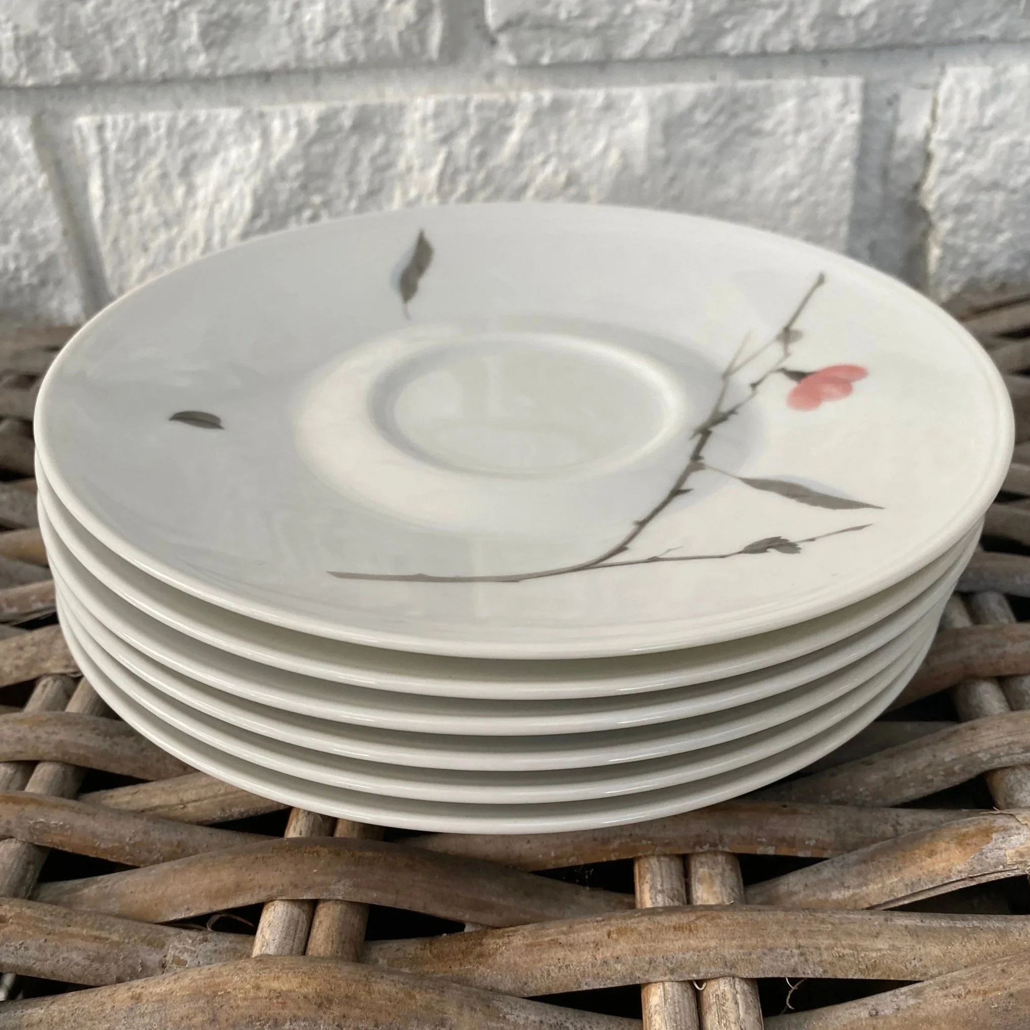 Stack of six Rosenthal Studio-Line saucers with floral motif