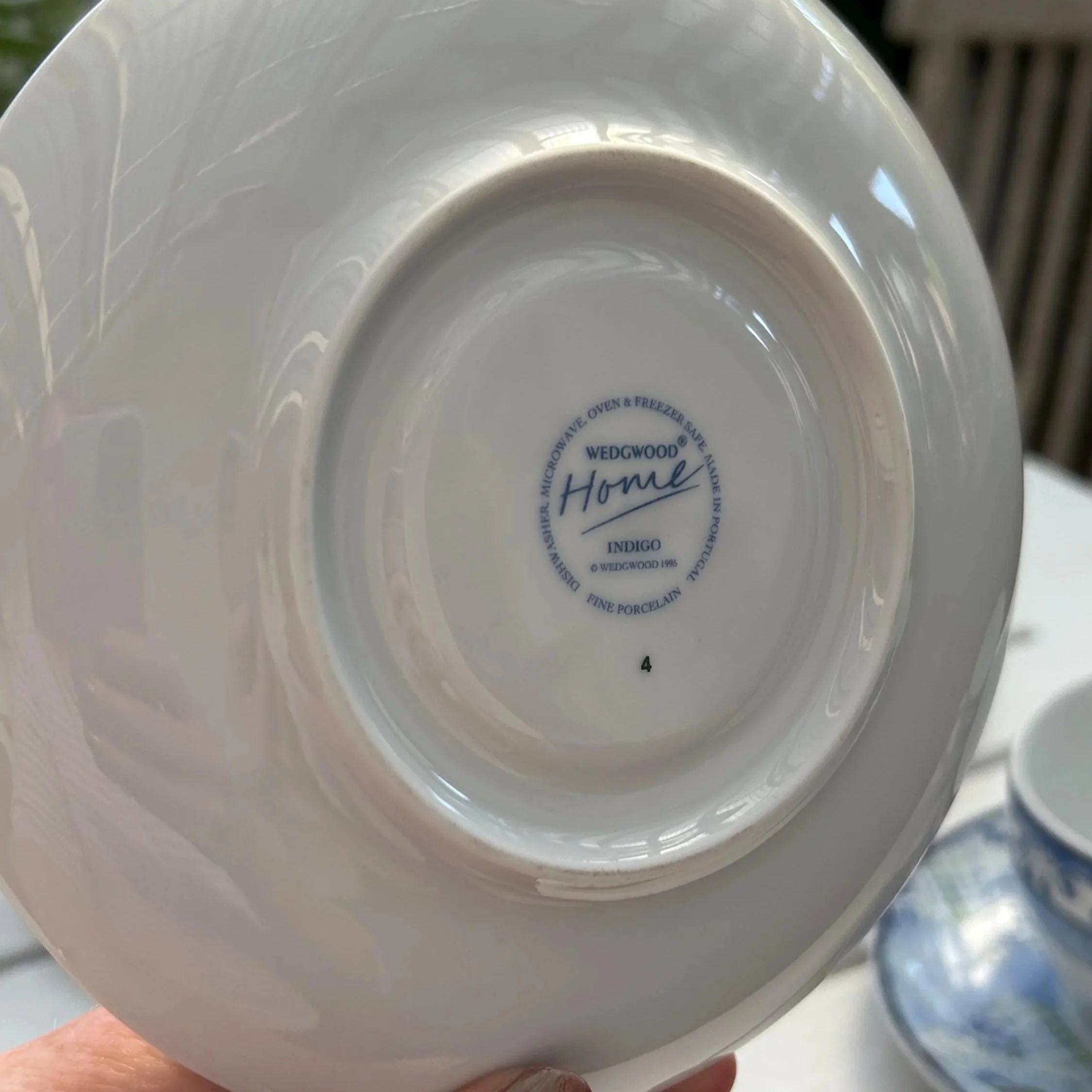 Underside of the saucer showing the Wedgwood Home Indigo backstamp