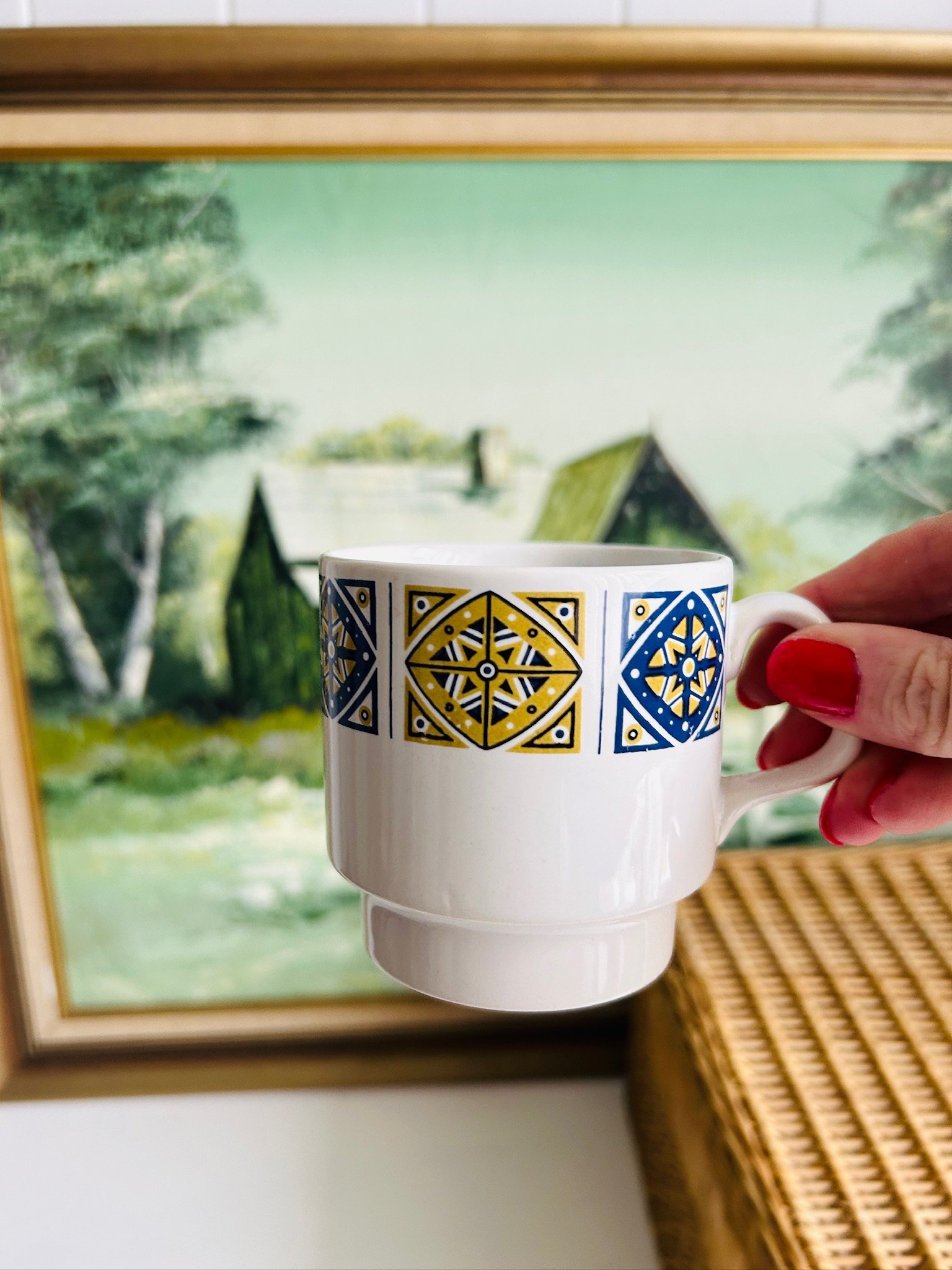 Single Staffordshire Midas coffee cup held in hand, showing scale and the bold geometric band.