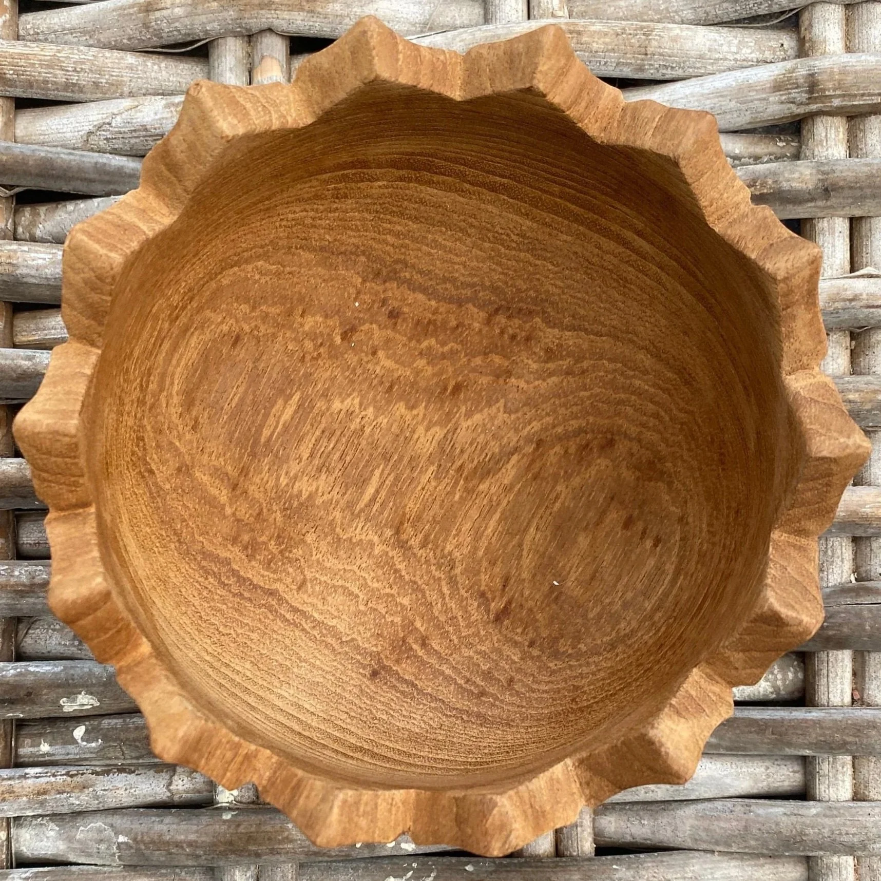 Close-up overhead view of single bowl with scalloped triangular rim