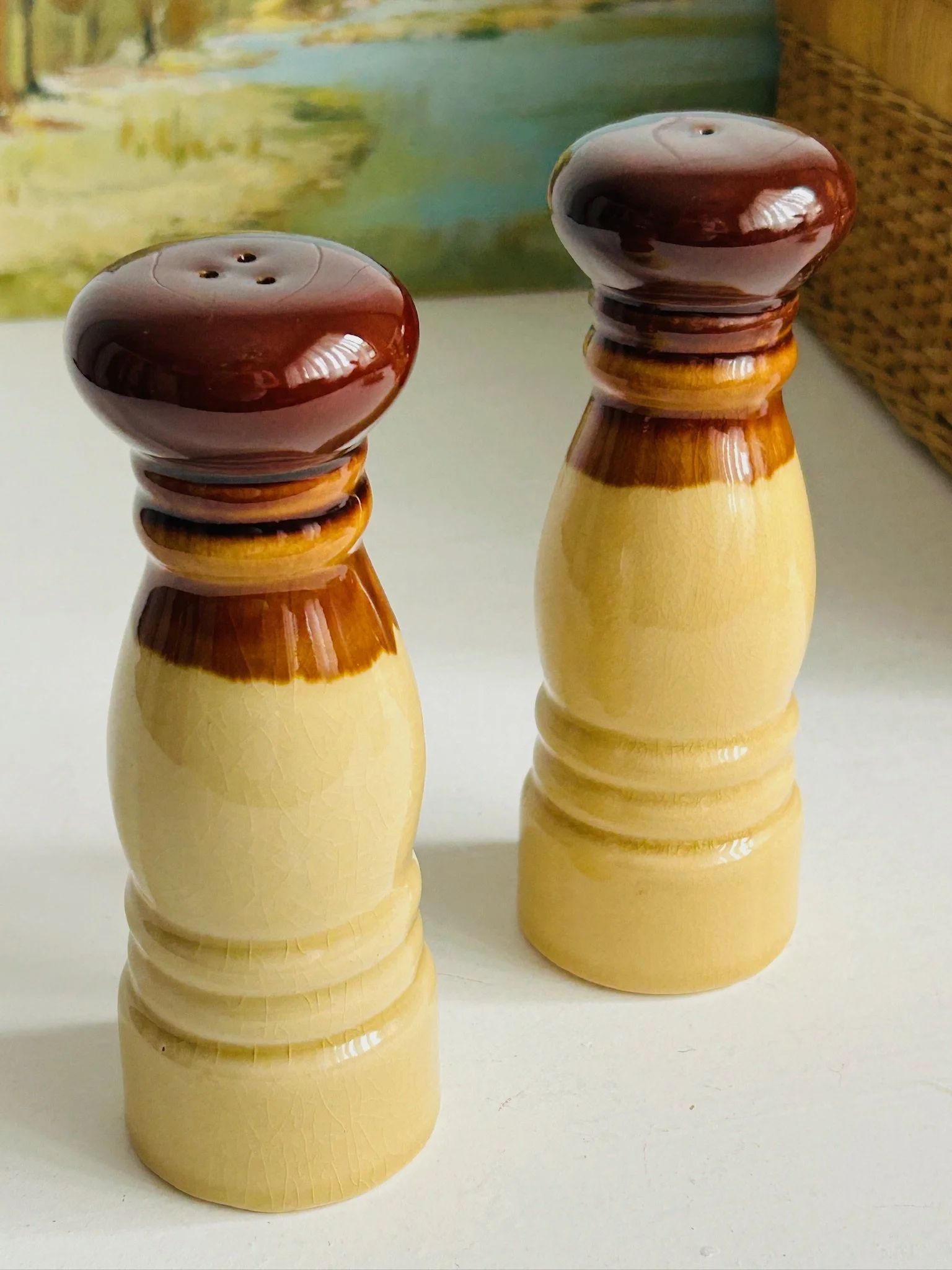 Side and back view of the shaker pair showing the plain glazed reverse