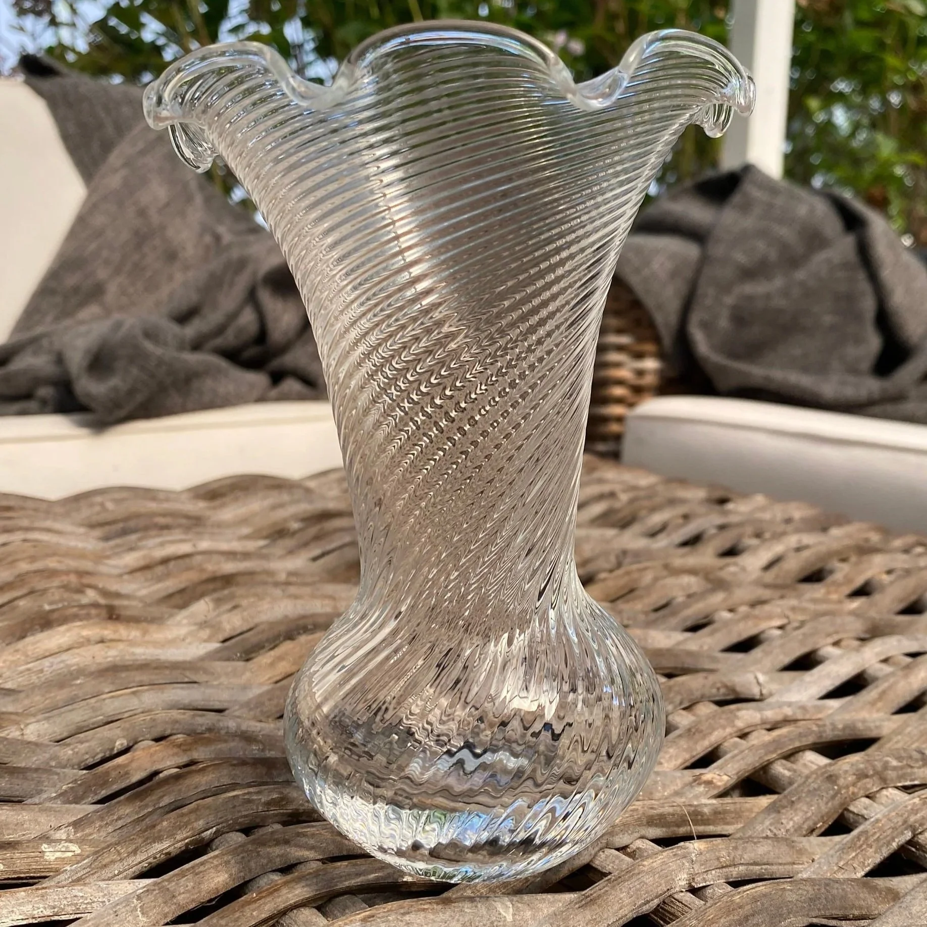 Front view of clear IVV Selezione swirl glass vase with flared scalloped edge