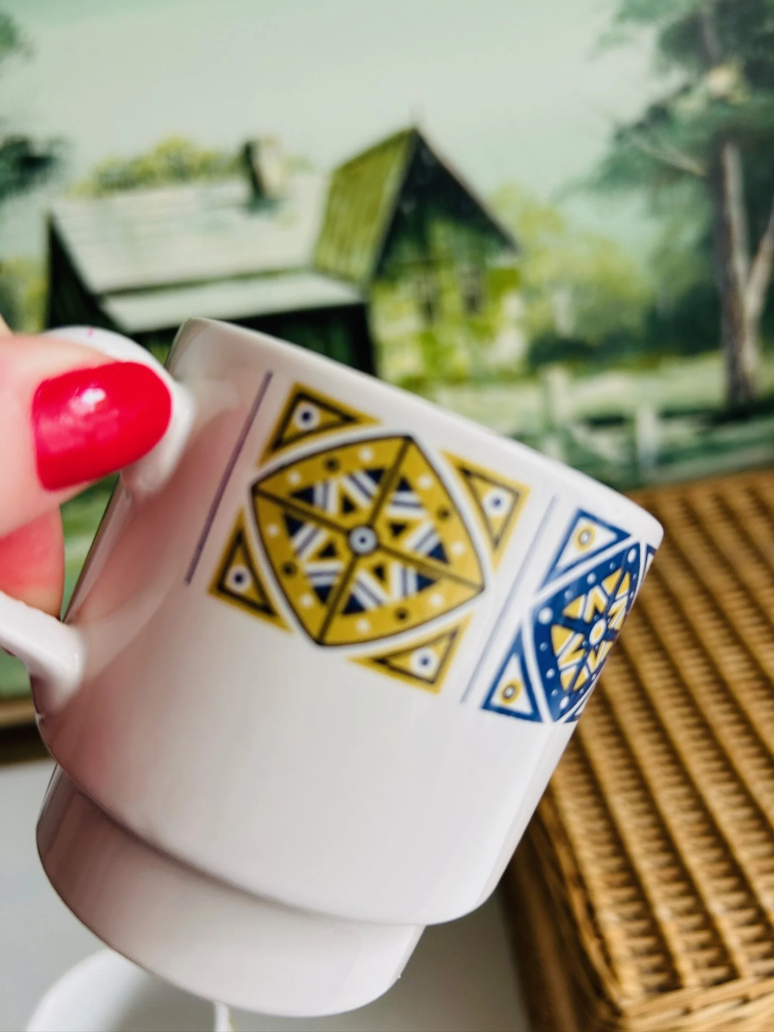 Close-up of the Staffordshire Midas pattern in mustard yellow and cobalt blue on white ceramic.