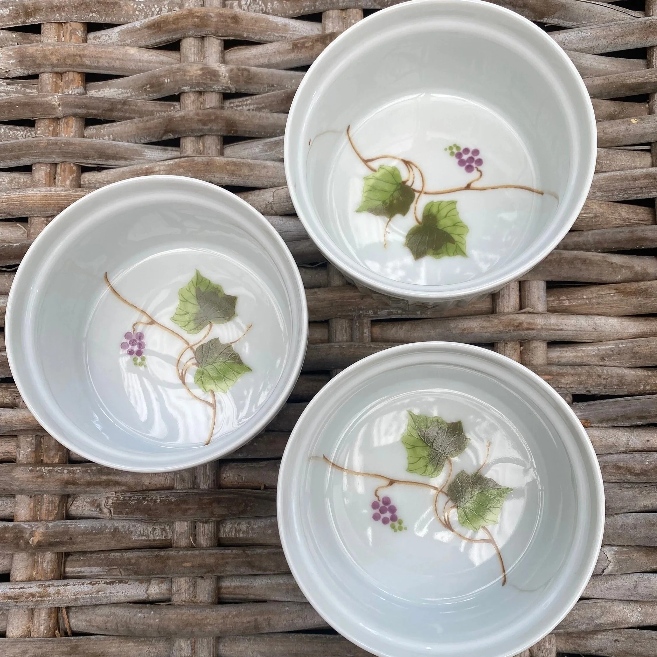 Top-down view of three ramekins displaying grapevine interior pattern