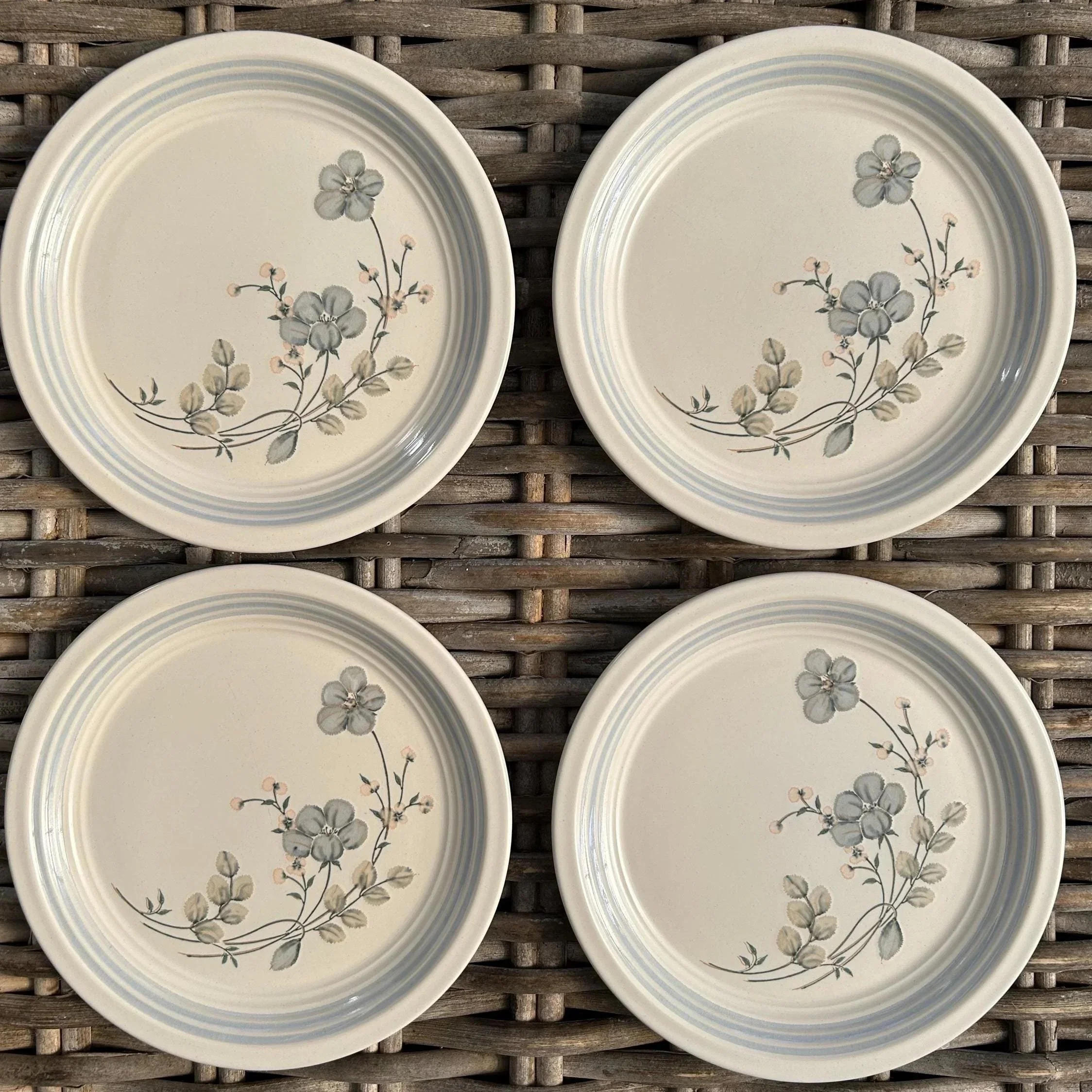 Grouped set of 4 side plates laid out in symmetrical pattern