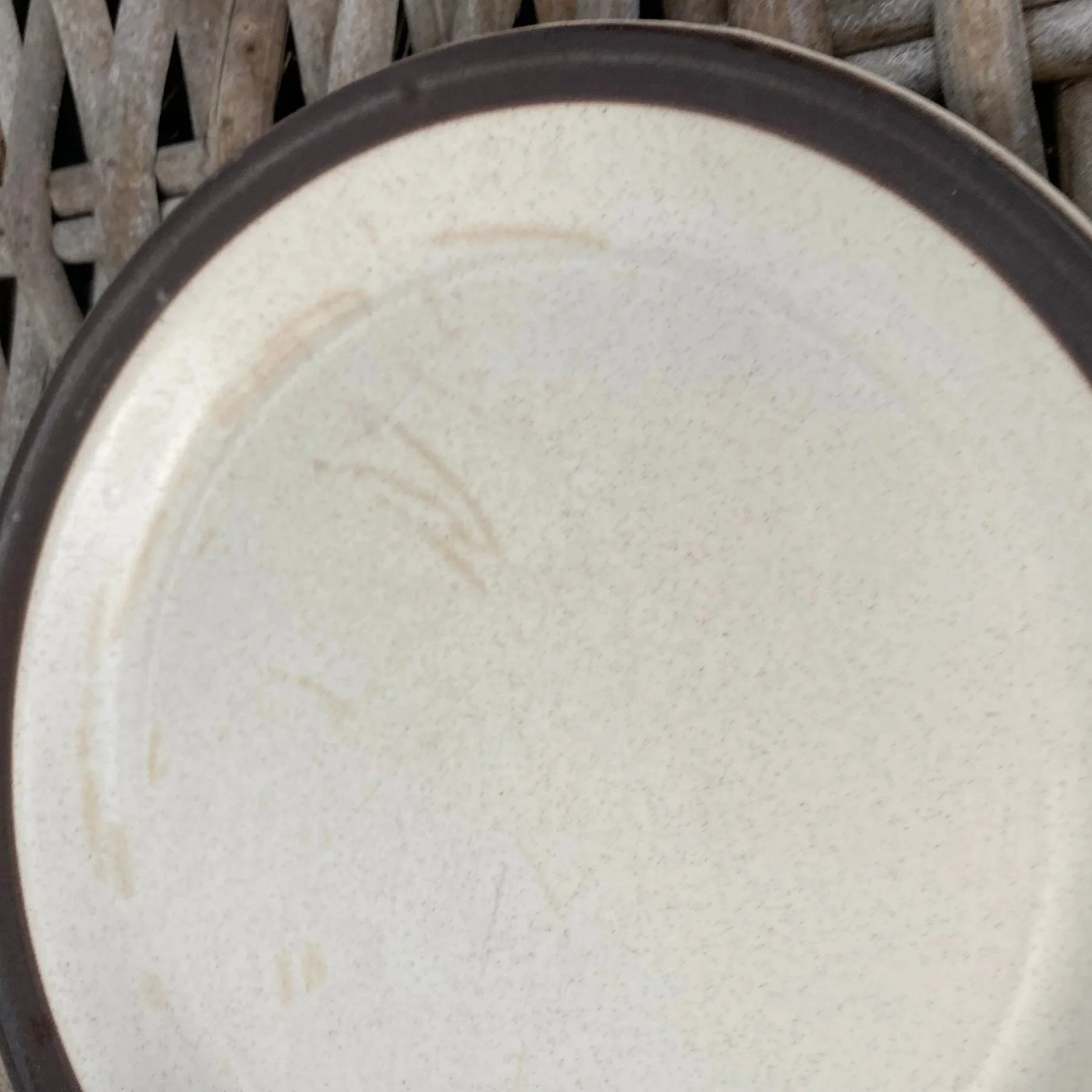 Close-up of plate surface with visible utensil markings