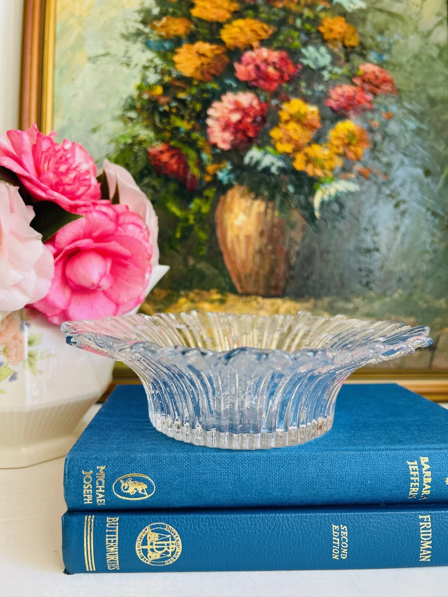 Side-on view of the Revontulet dish held in hand, showing the shallow depth and undulating rim