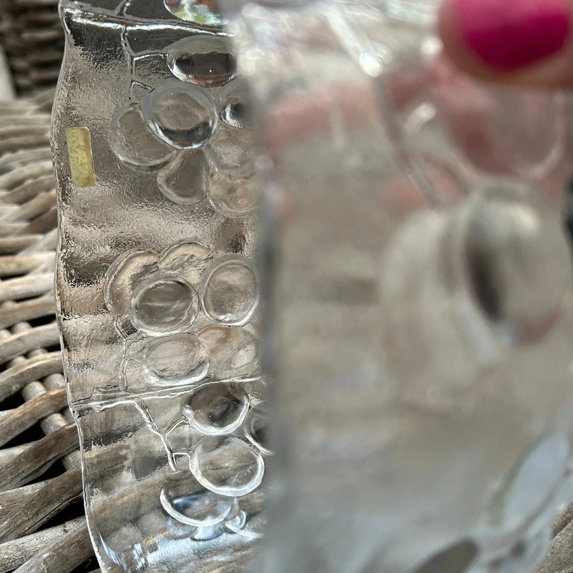 Side angle showing light catching the raised grape clusters