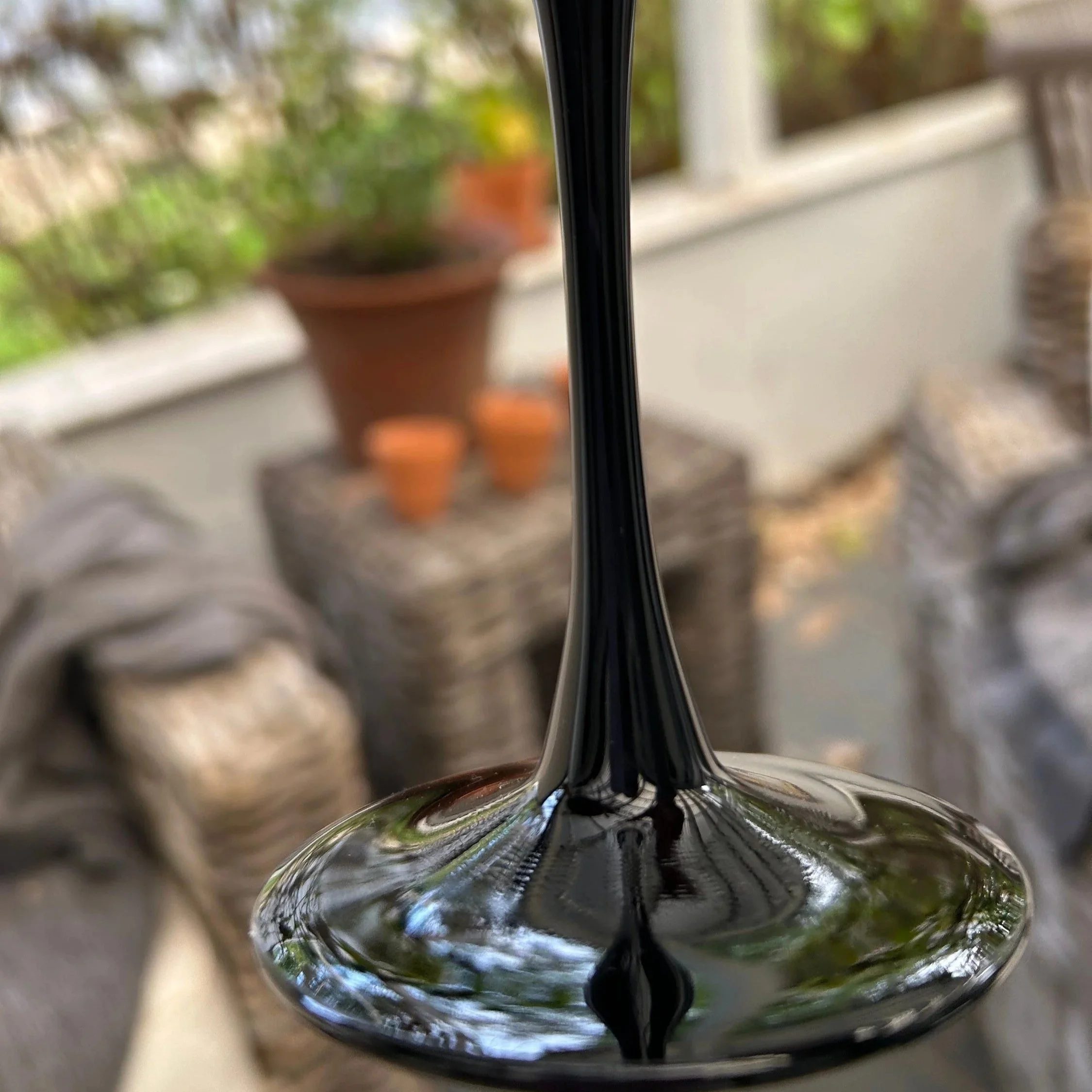 Detailed view of stem and base connection with high-gloss finish
