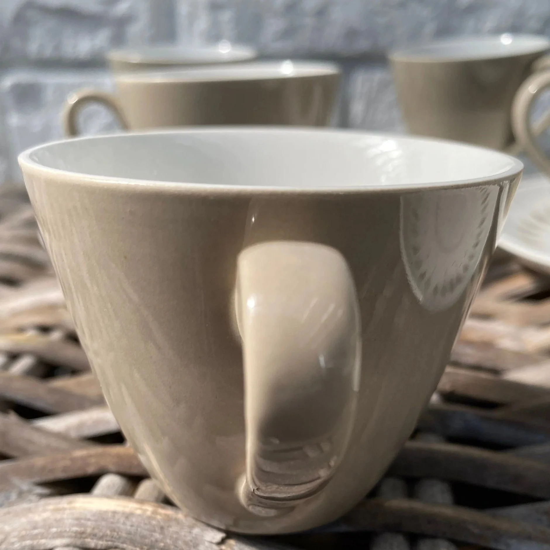 Side view of teacup showing handle and light reflection