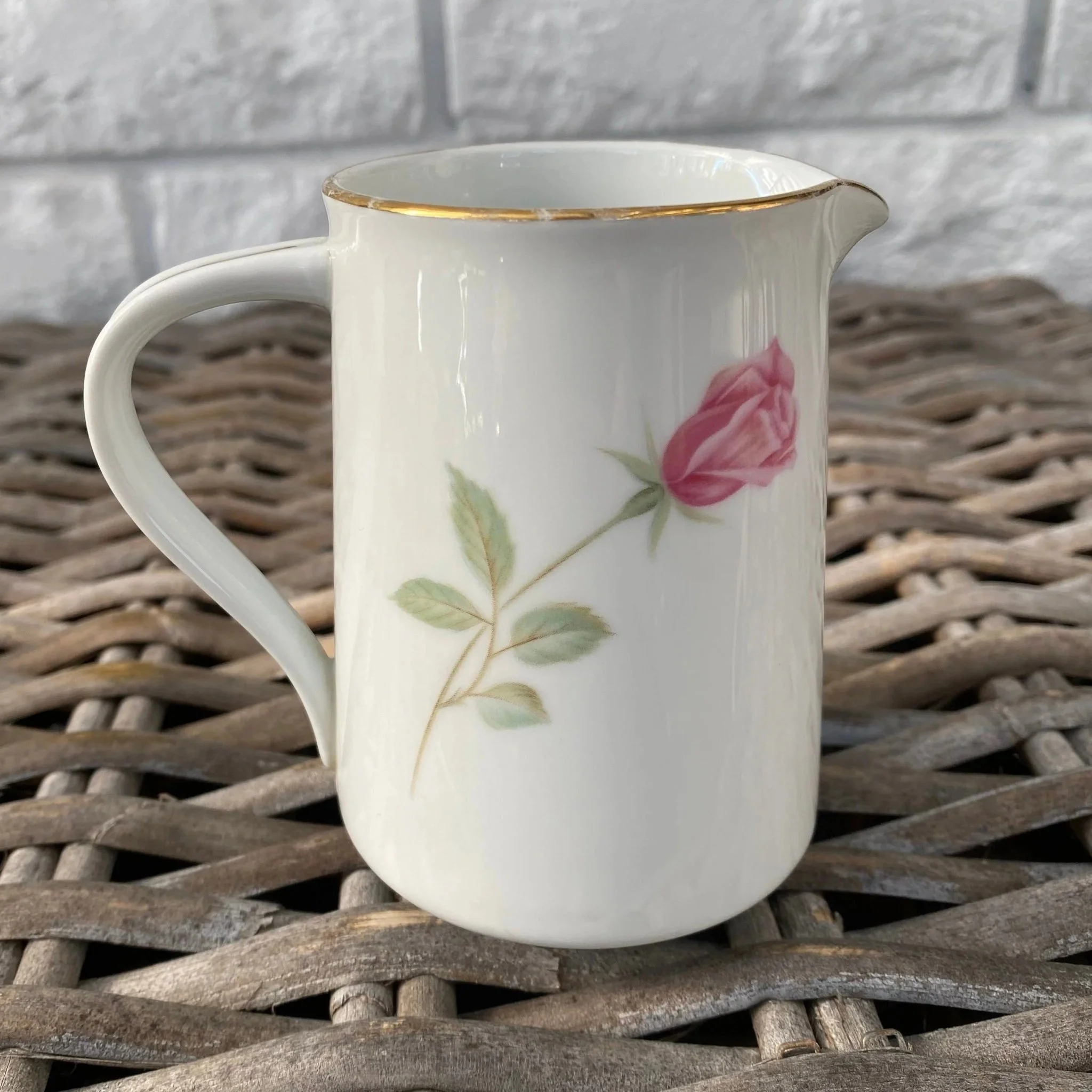 Reverse side showing single rose stem and handle