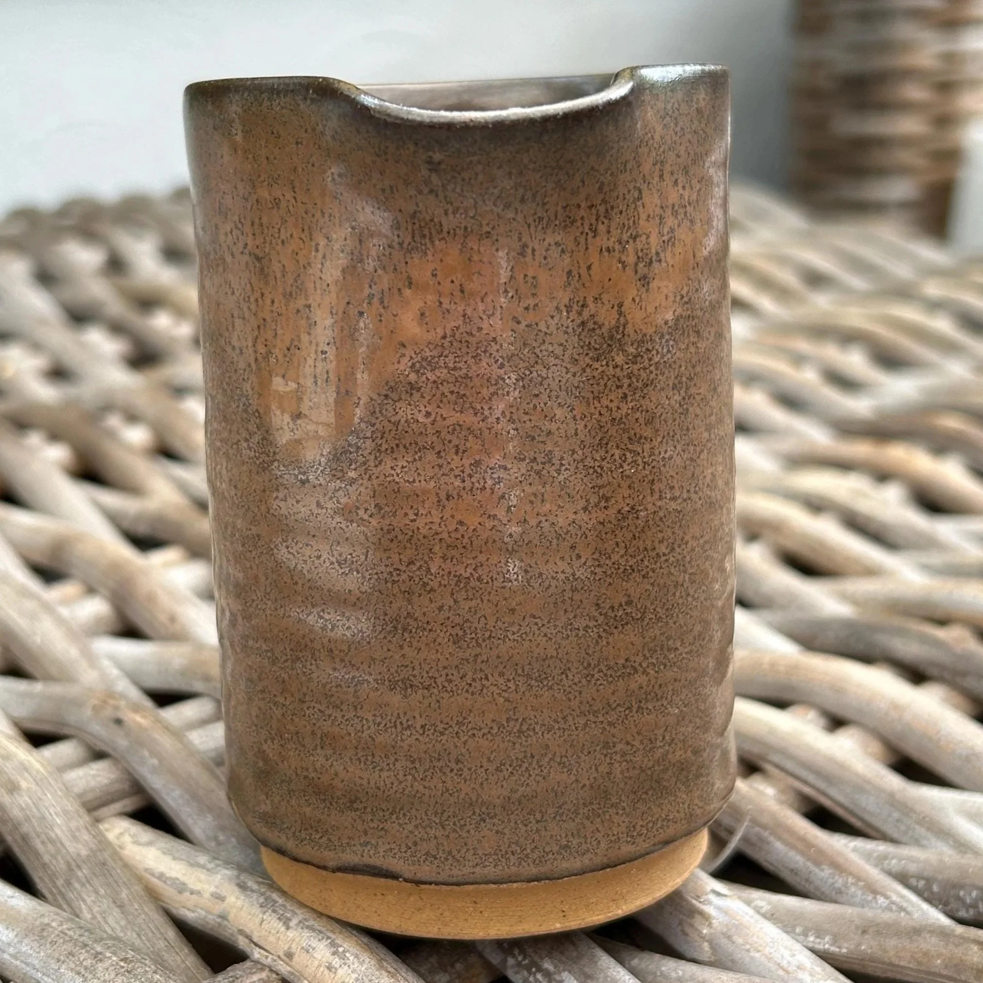 Rear view with rustic glaze details and vertical striations