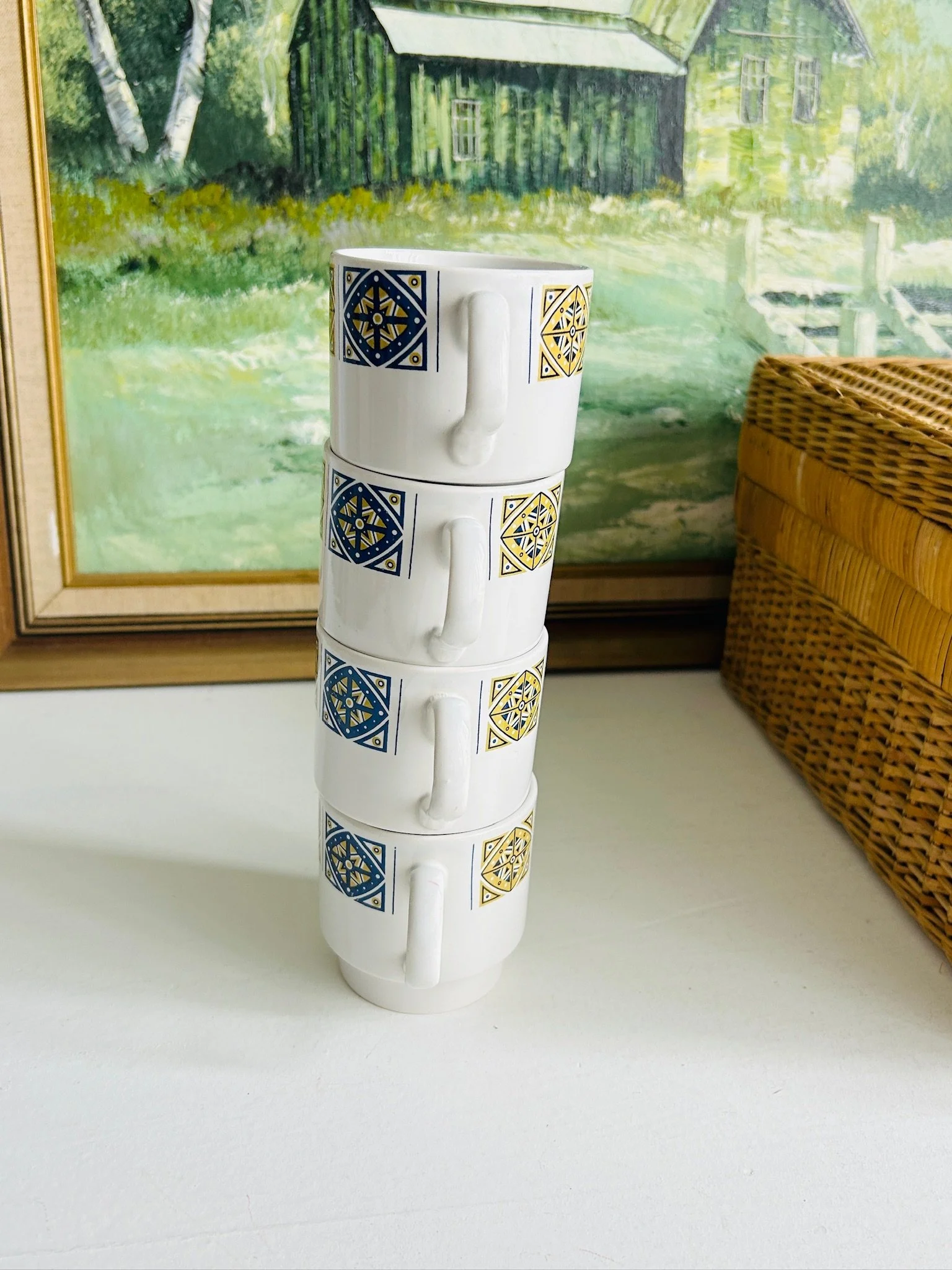 Four Staffordshire Midas cups stacked vertically to demonstrate the space-saving stackable design.