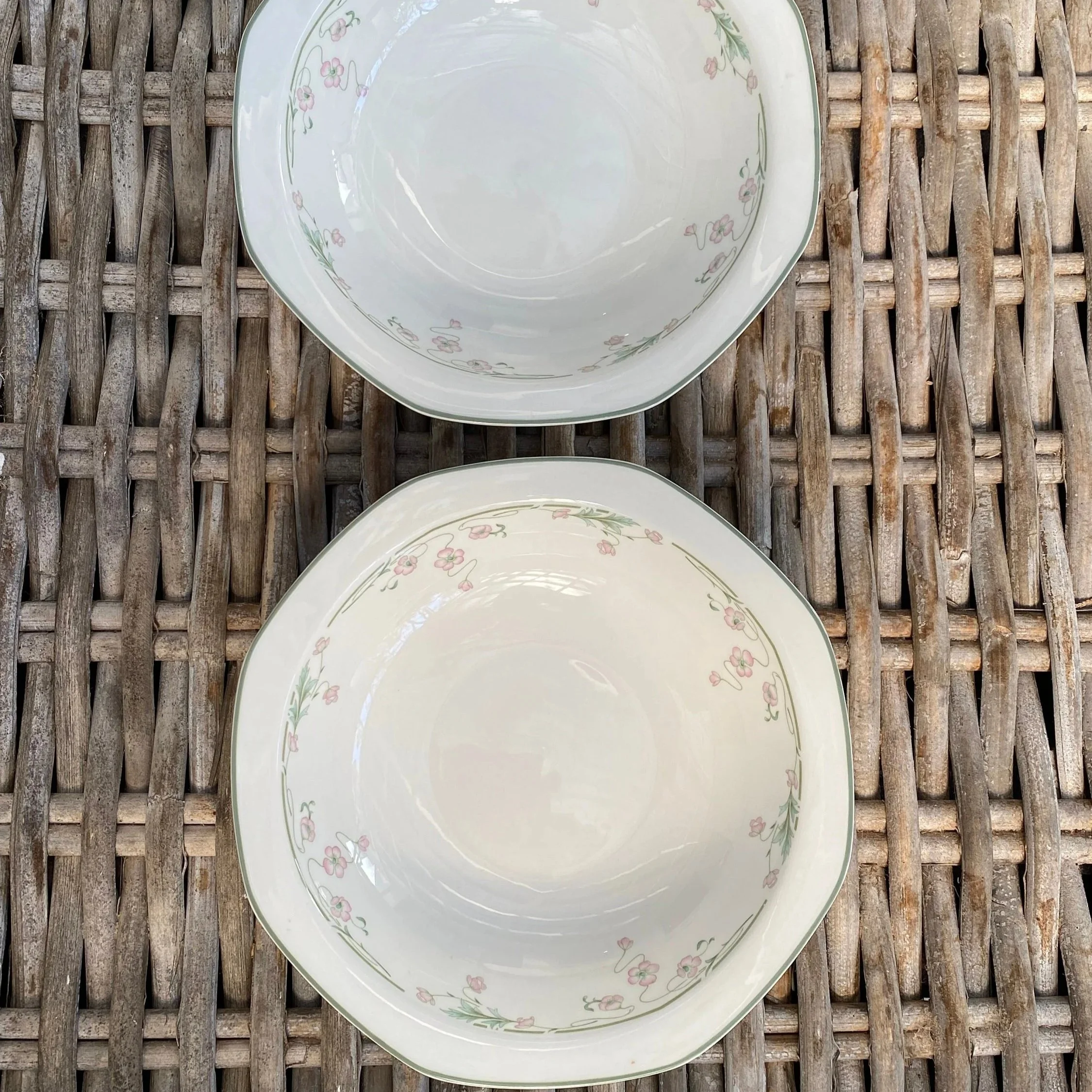 Two Caprice bowls stacked with scalloped edges visible