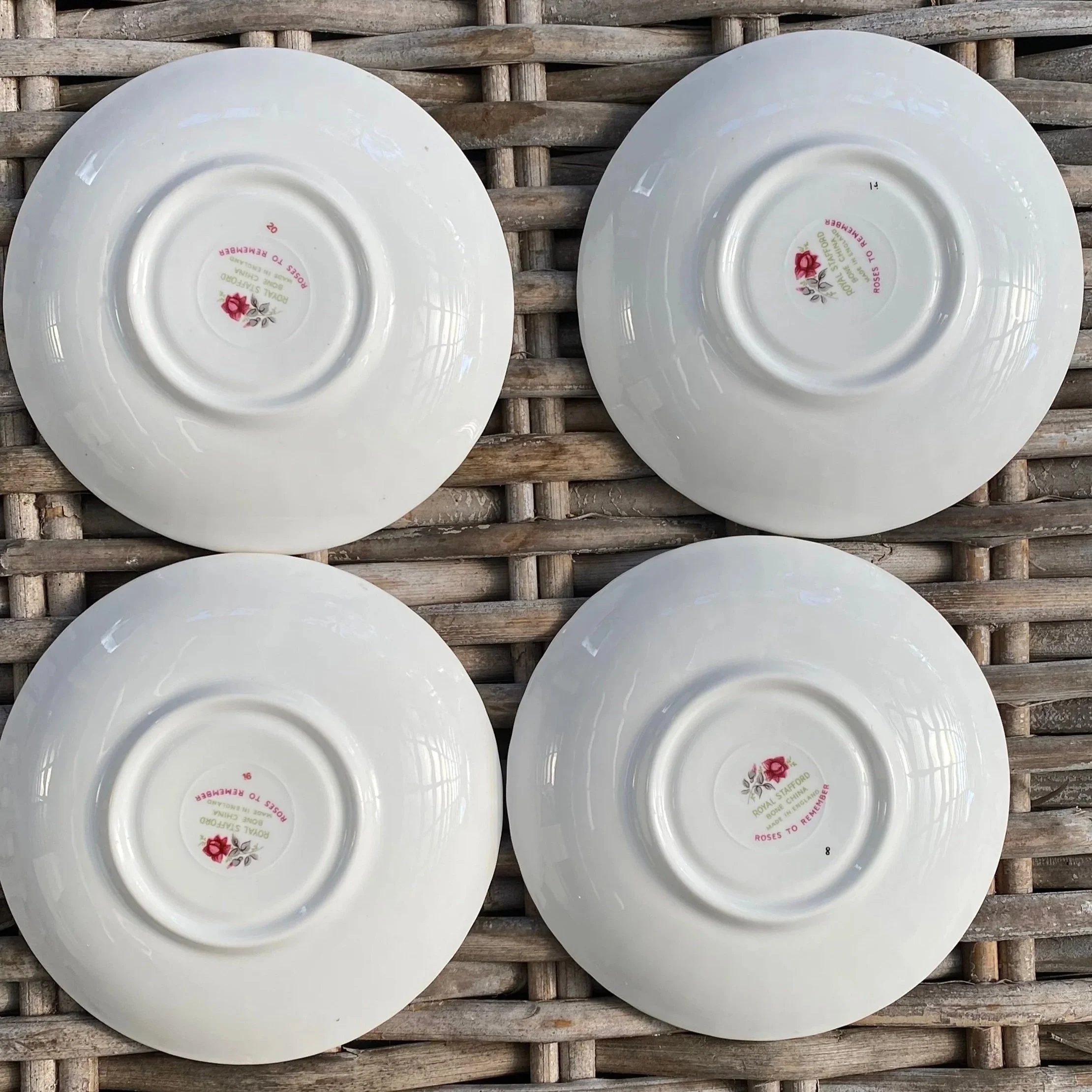 Underside view of the saucers revealing maker’s backstamp