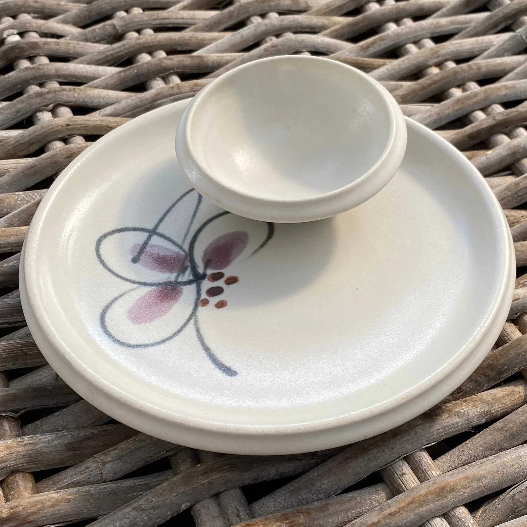 Top view of chip and dip bowl showing floral design and central dip section
