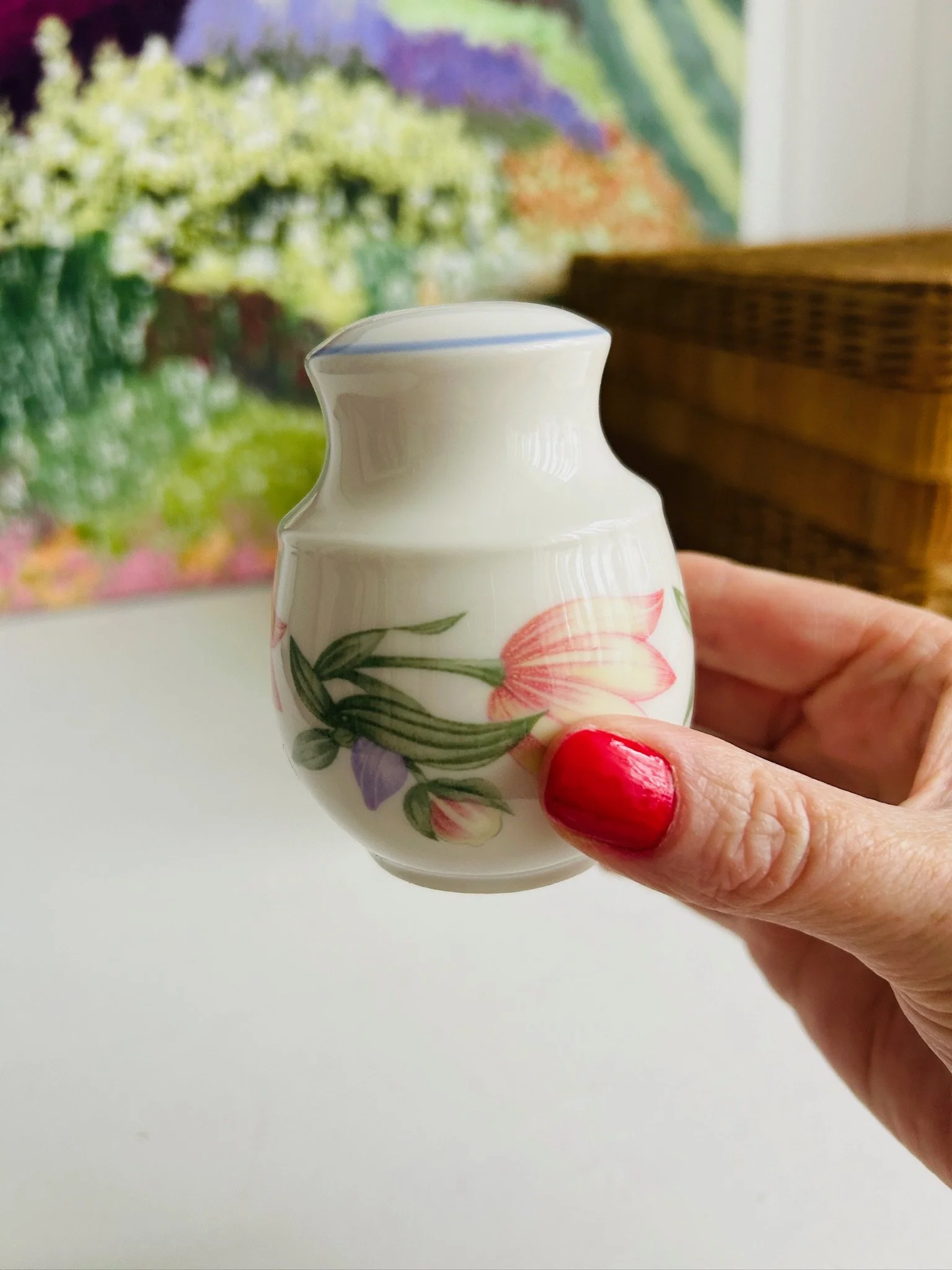 Single Royal Doulton Blooms shaker held in hand, showing the floral motif and softly rounded silhouette