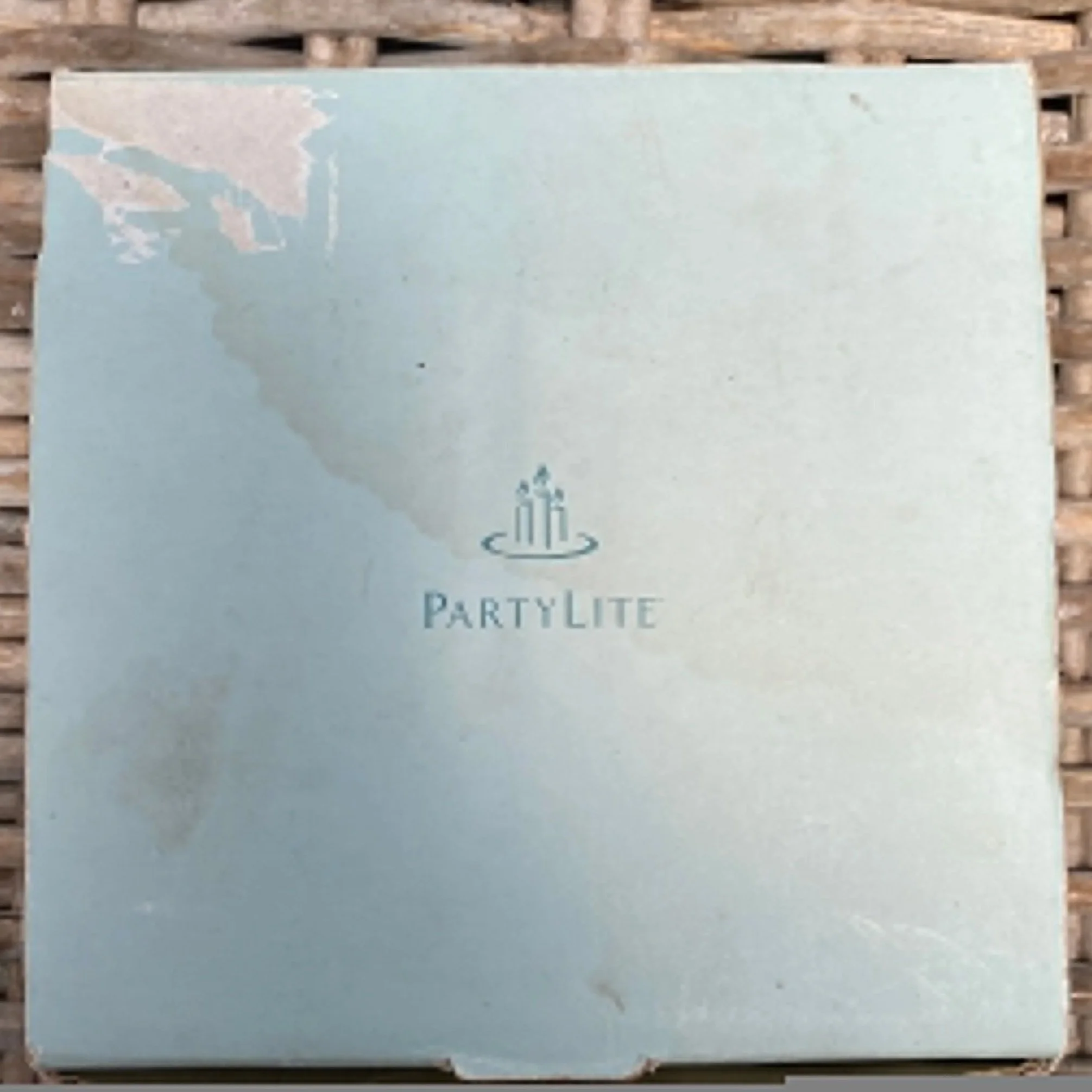 Light blue original PartyLite box with logo, showing wear