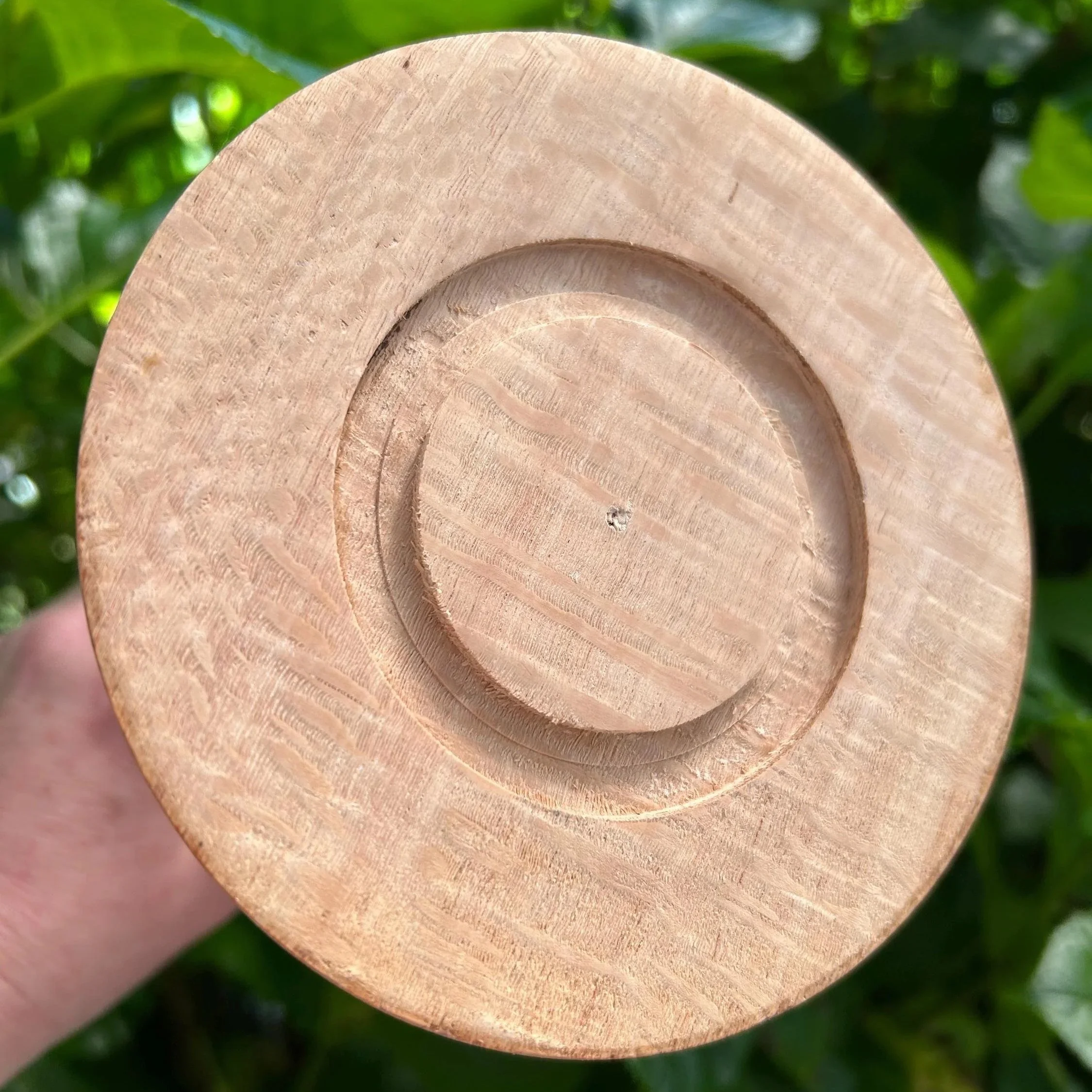 Underside of base showing turned wood details