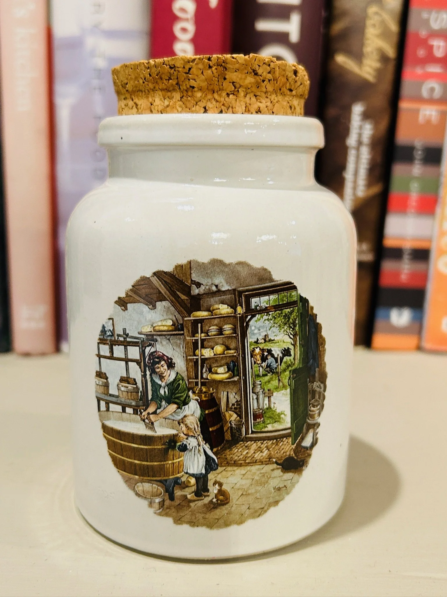 Single ceramic mustard pot with cork lid, featuring the hand-painted cheese shop scene centred on the front.