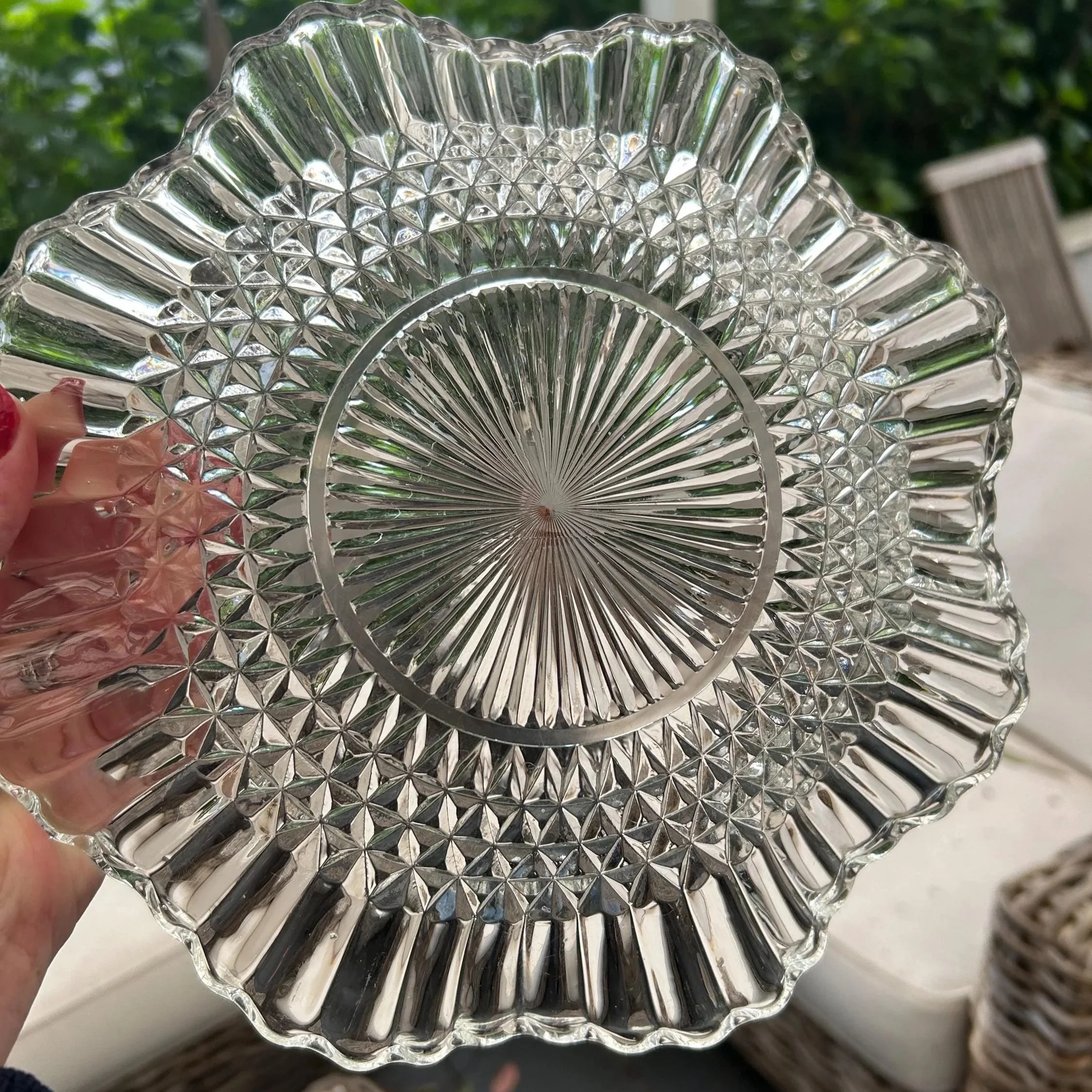 Back view showing circular diamond-cut design and flared rim