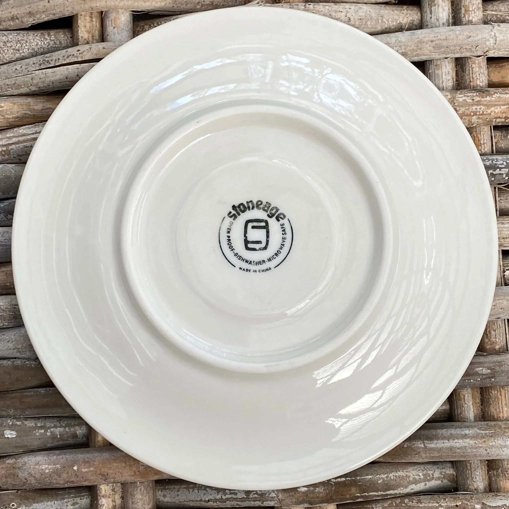Underside of saucer showing Stoneage maker's mark