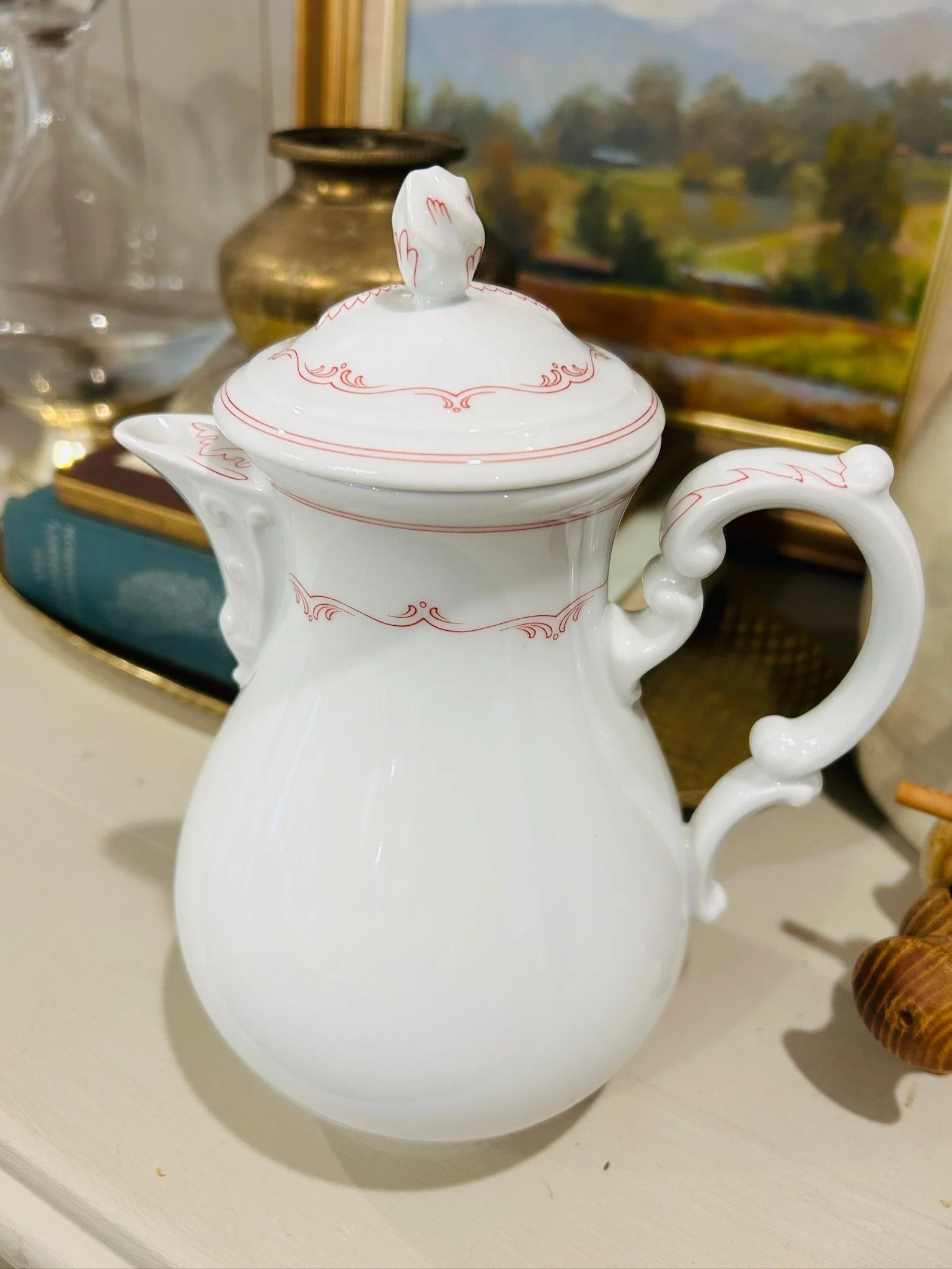 Front angle of the Hutschenreuther coffee pot with lid in place, showing the full silhouette, decorative handle, and floral border.