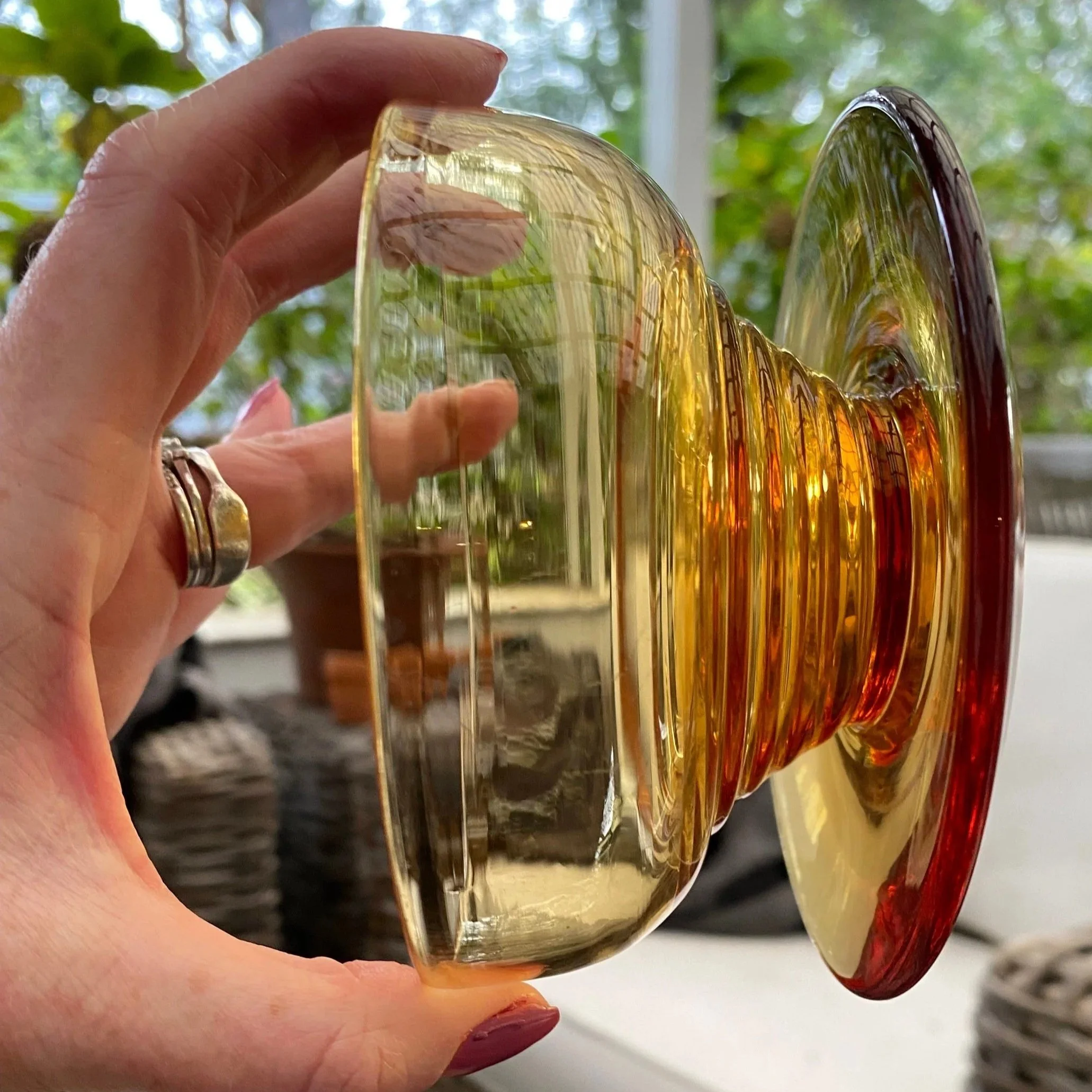 Side profile view showing angled shape and footed base