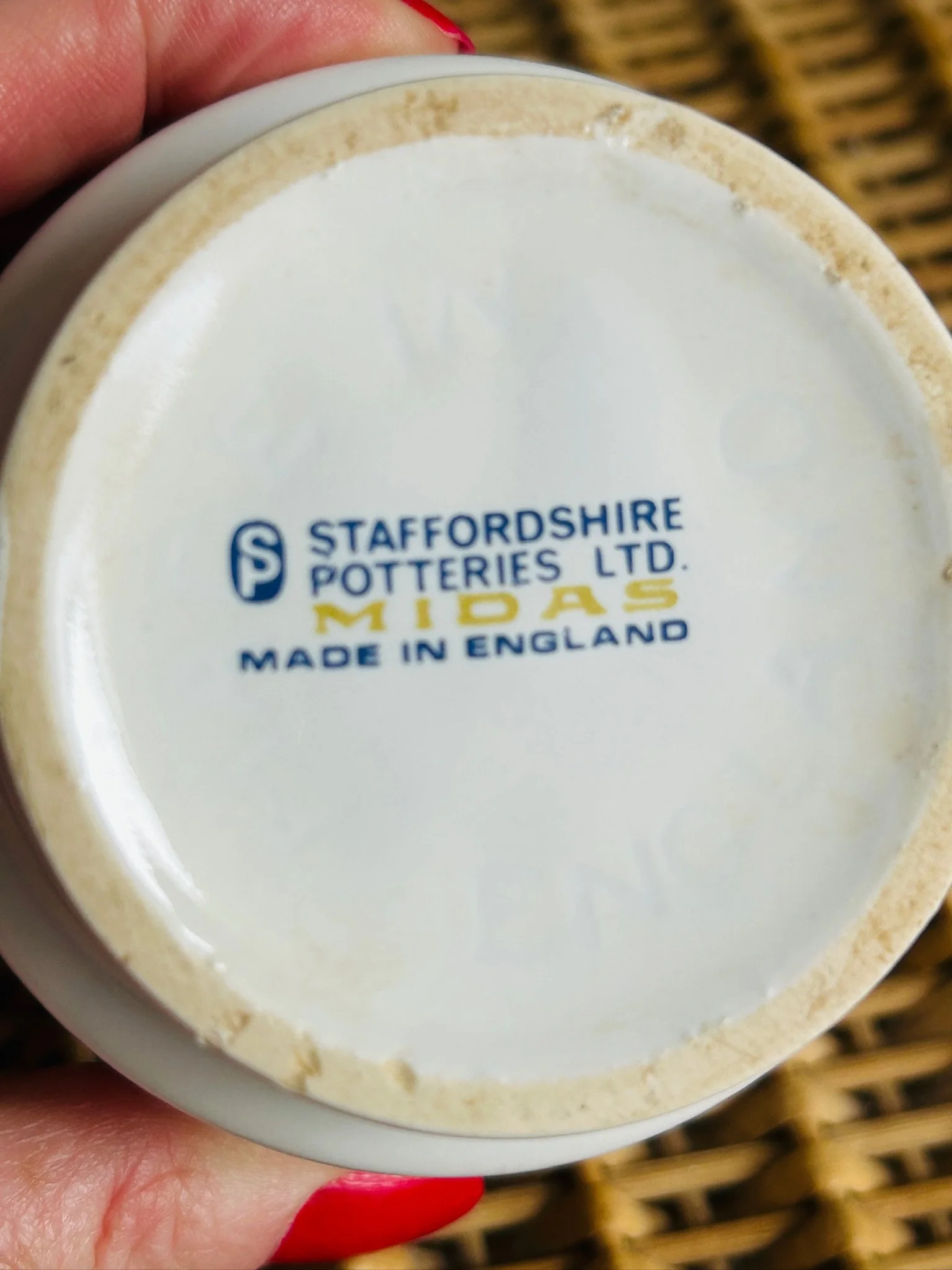 Group display of four Staffordshire Midas coffee cups arranged together on a tabletop.