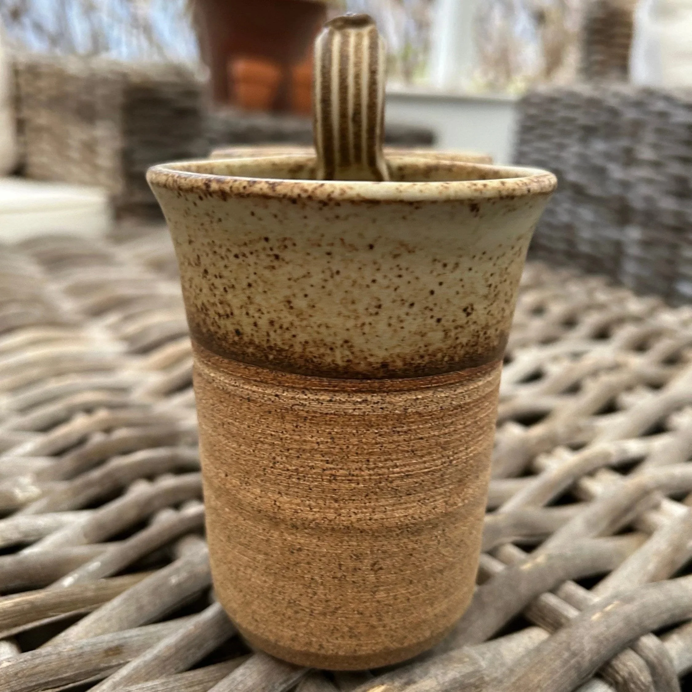 Side view showing curved loop handle and tri-tone glaze variation