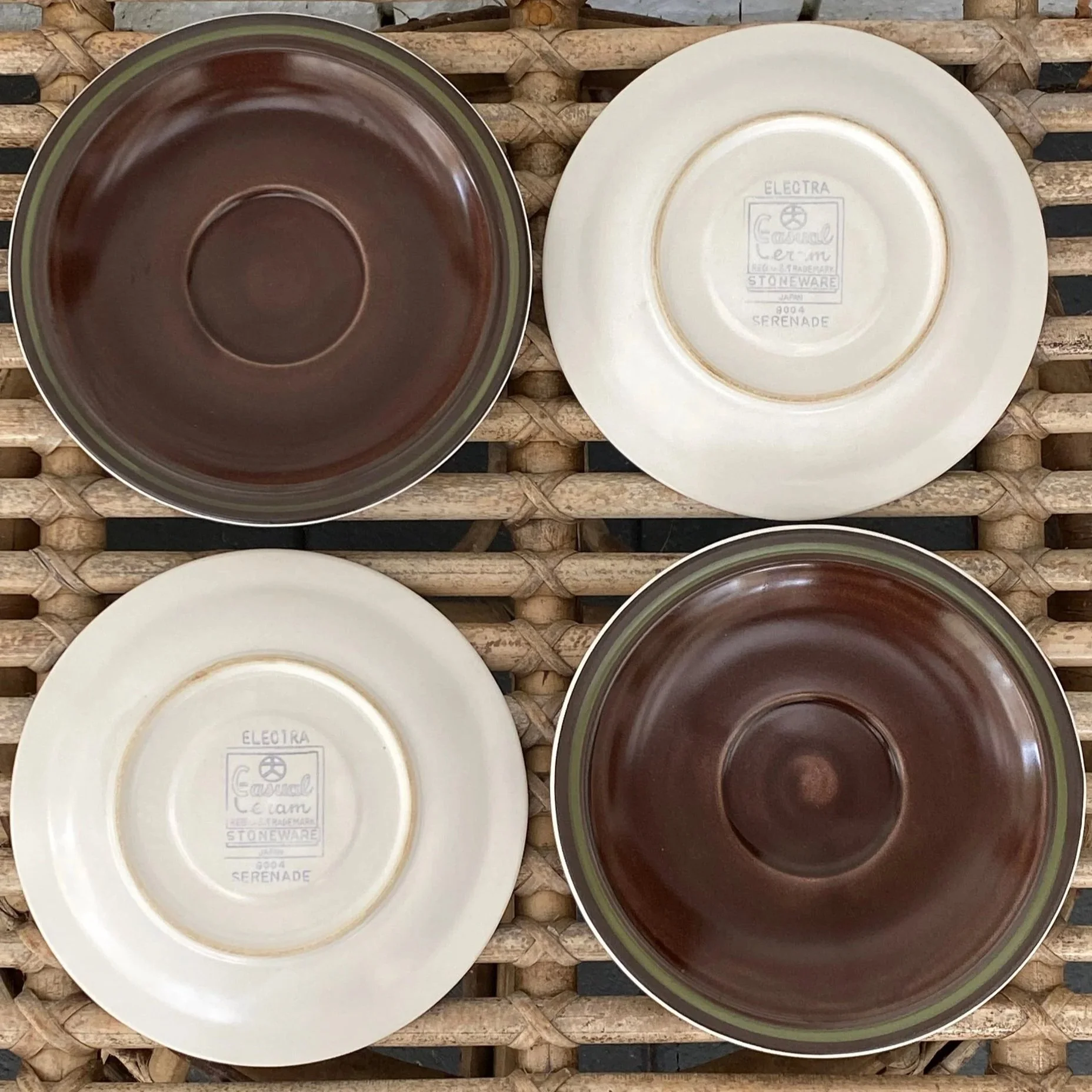 Front and back of saucers arranged to show glaze and maker stamp