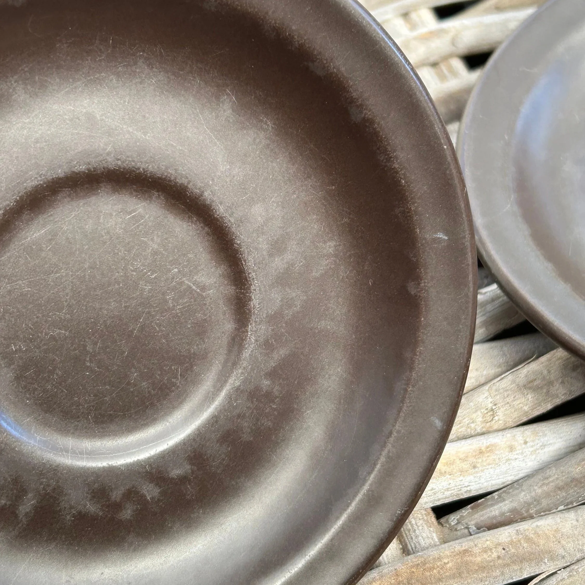 Close-up of saucer showing visible crazing in glaze