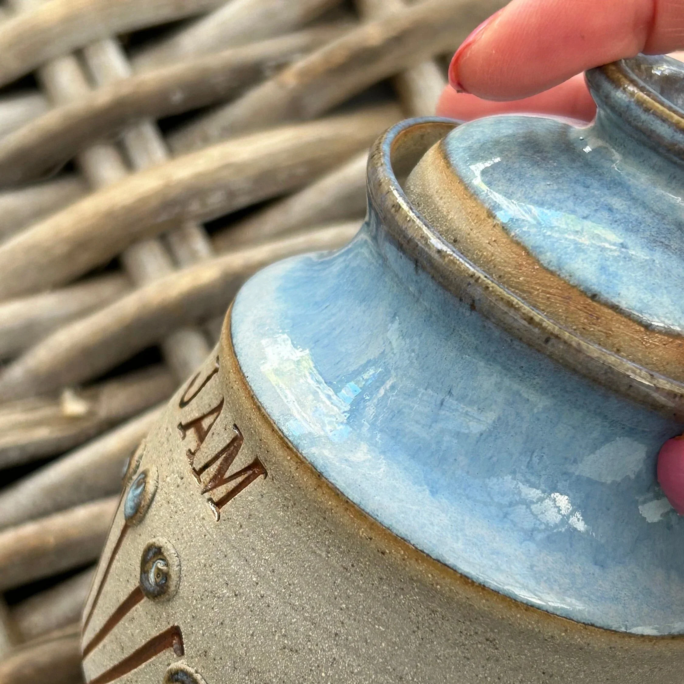 Lid detail showing natural glaze transitions and spoon notch