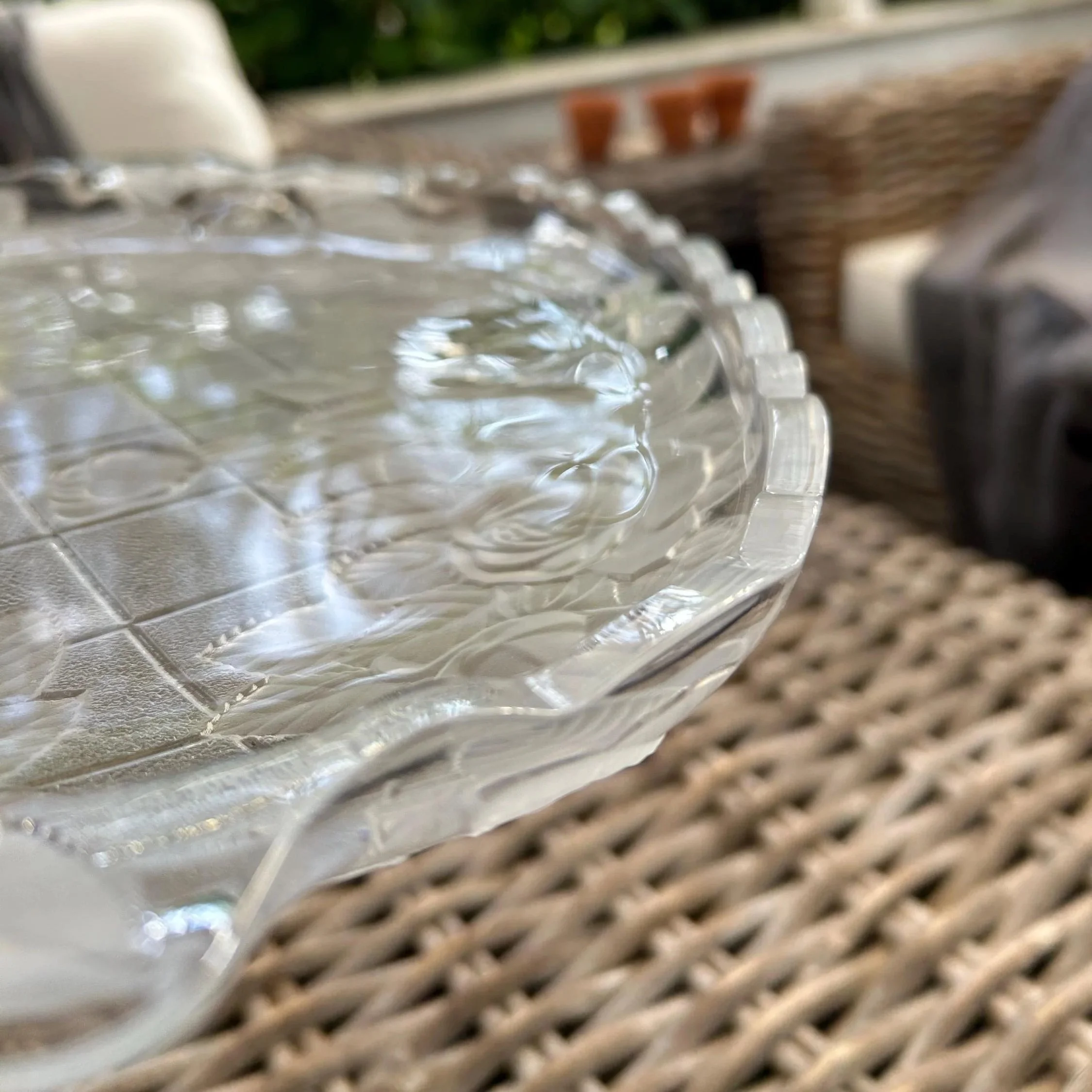 Angled view of surface – crosshatched backdrop and frosted floral accents