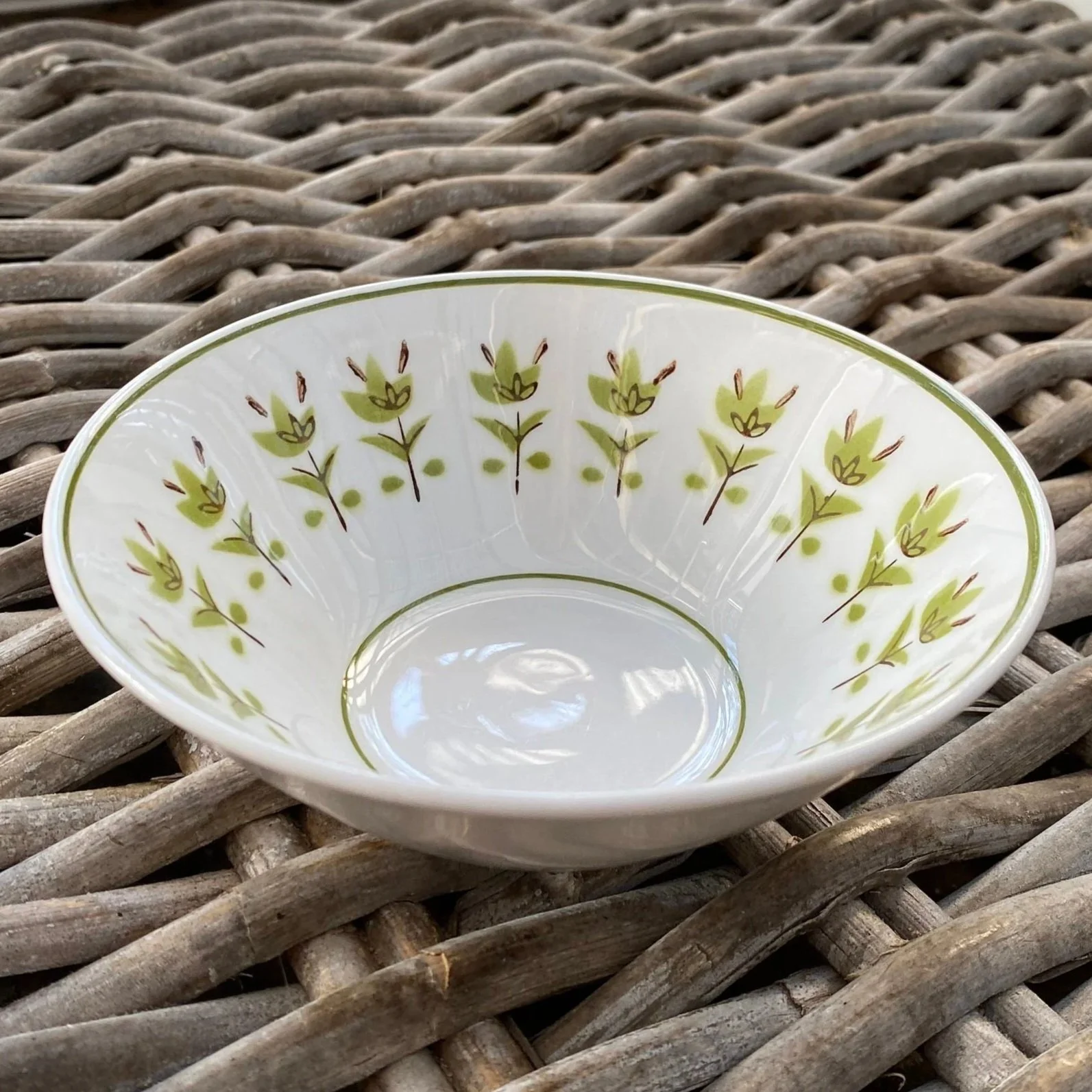 Angled view of bowl sitting on outdoor rattan surface