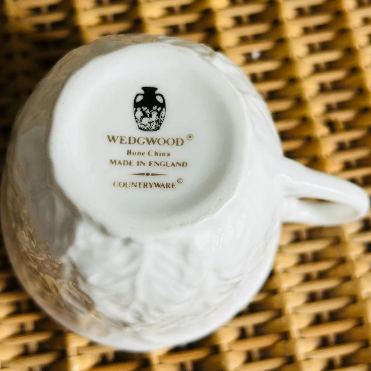 Underside of the Wedgwood cup showing the Wedgwood Bone China made in England backstamp on the base.