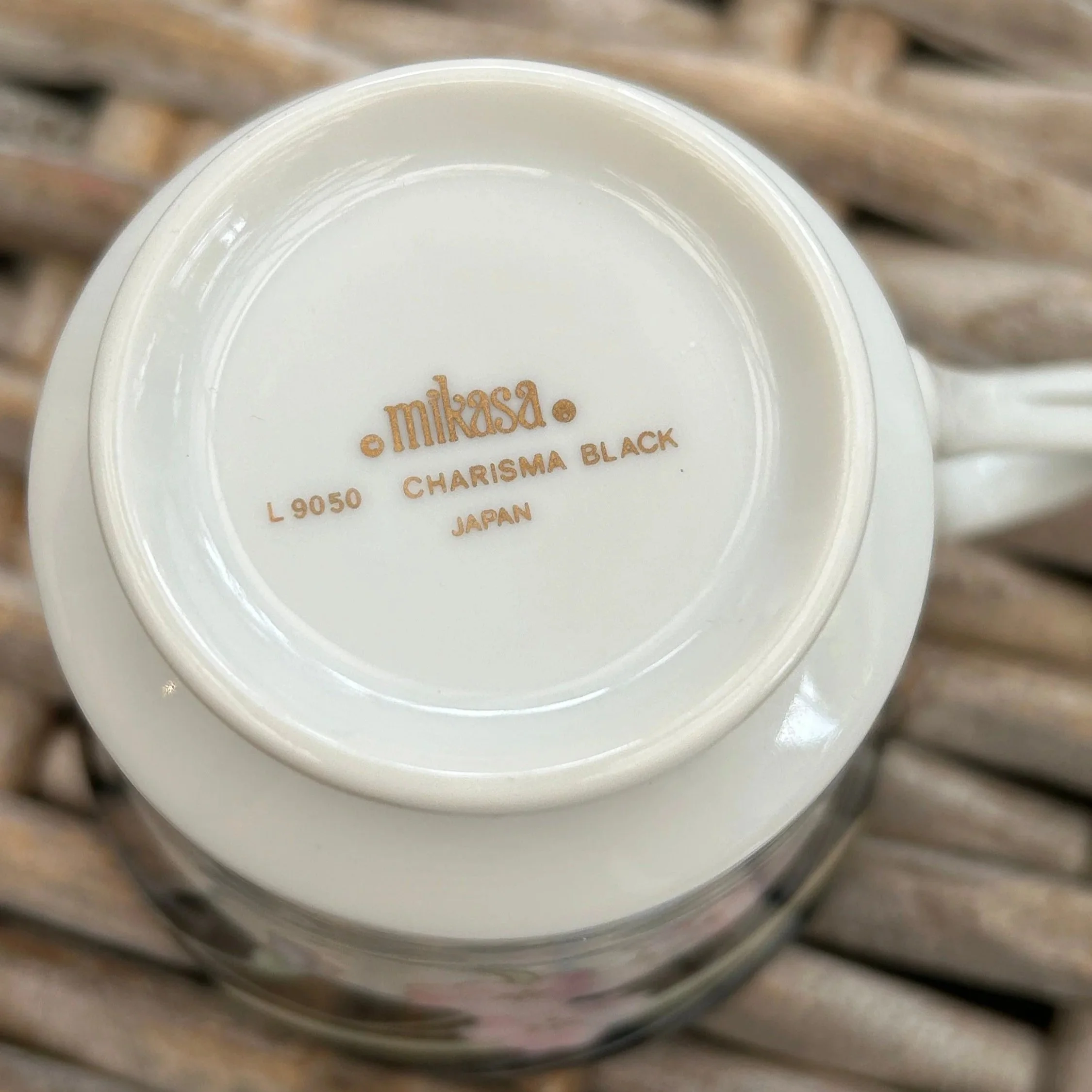 Underside of cup showing Mikasa mark and L9050 Charisma Black label