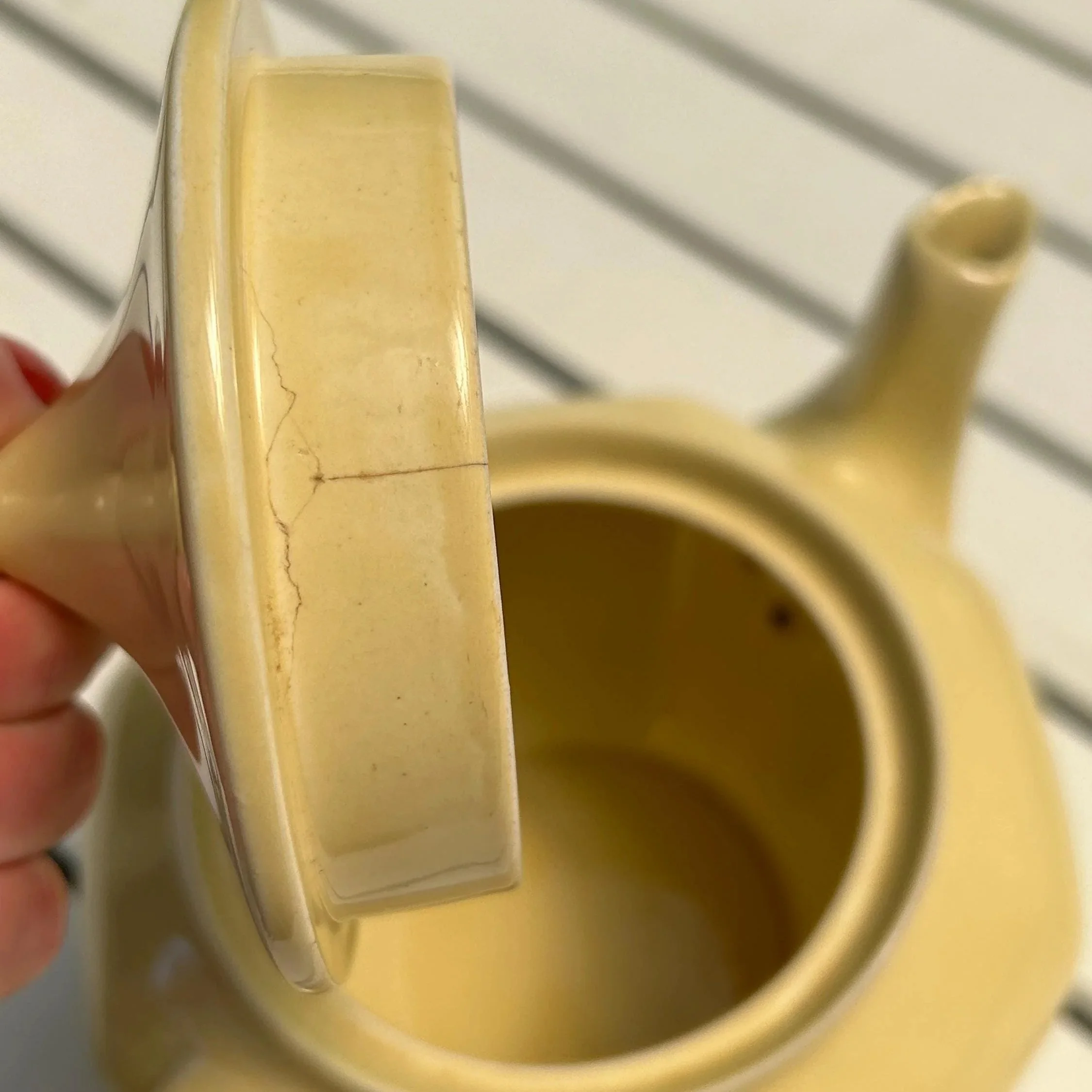 Close-up of minor crack inside lid rim