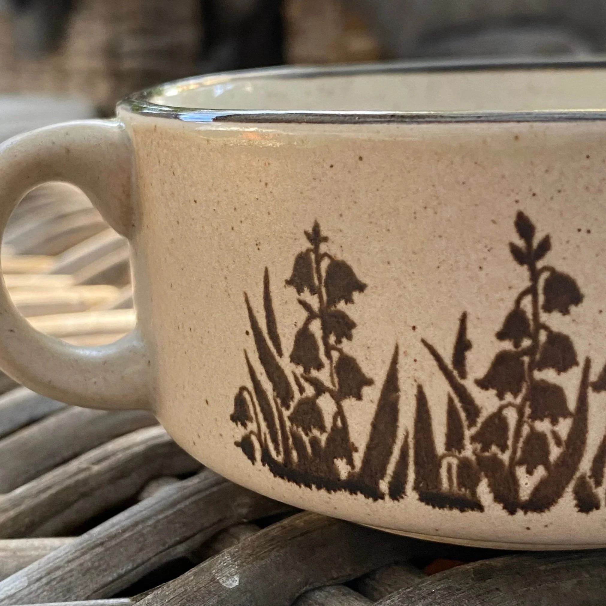 Side profile focusing on handle and botanical design