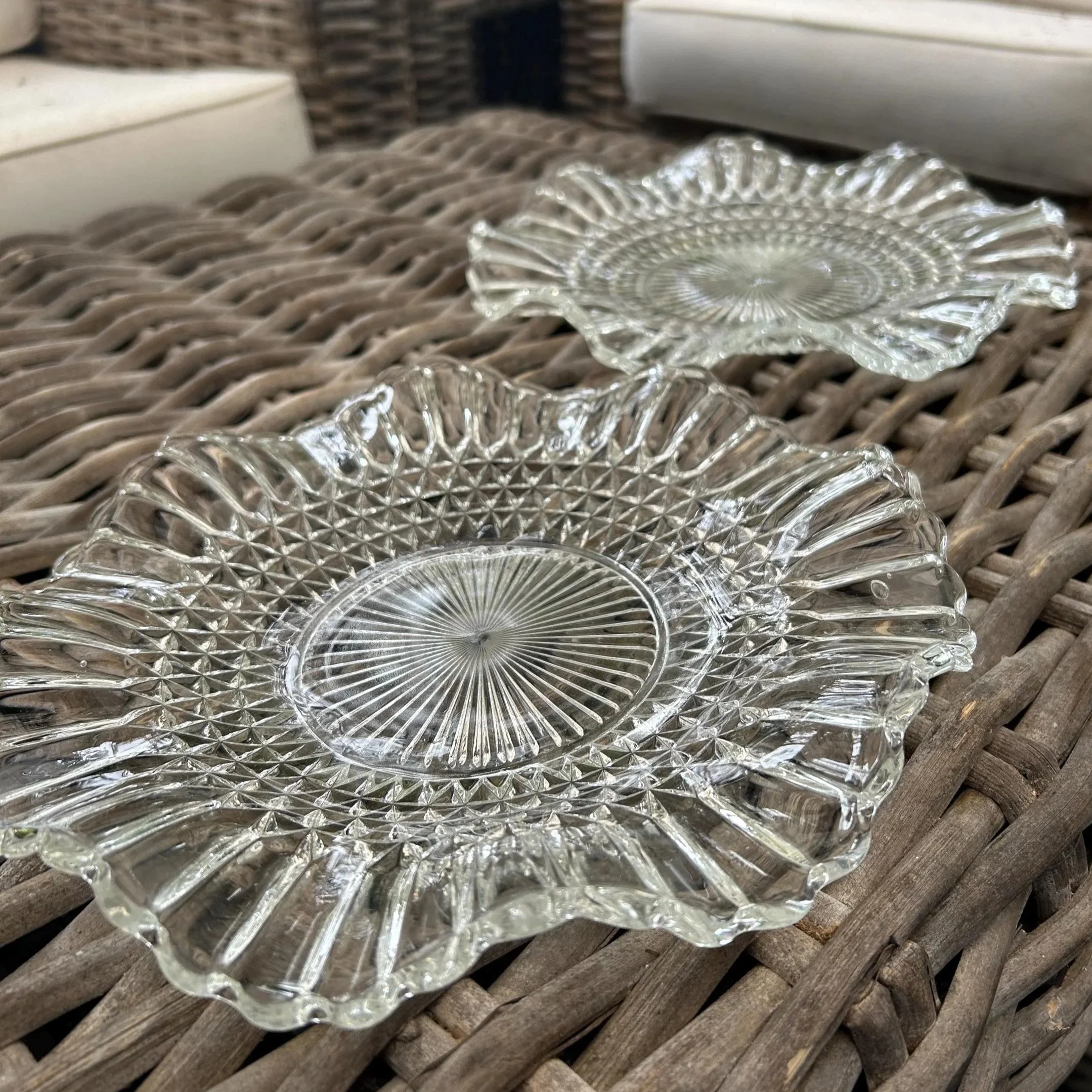 Pair of plates resting on wicker, showing surface and edges