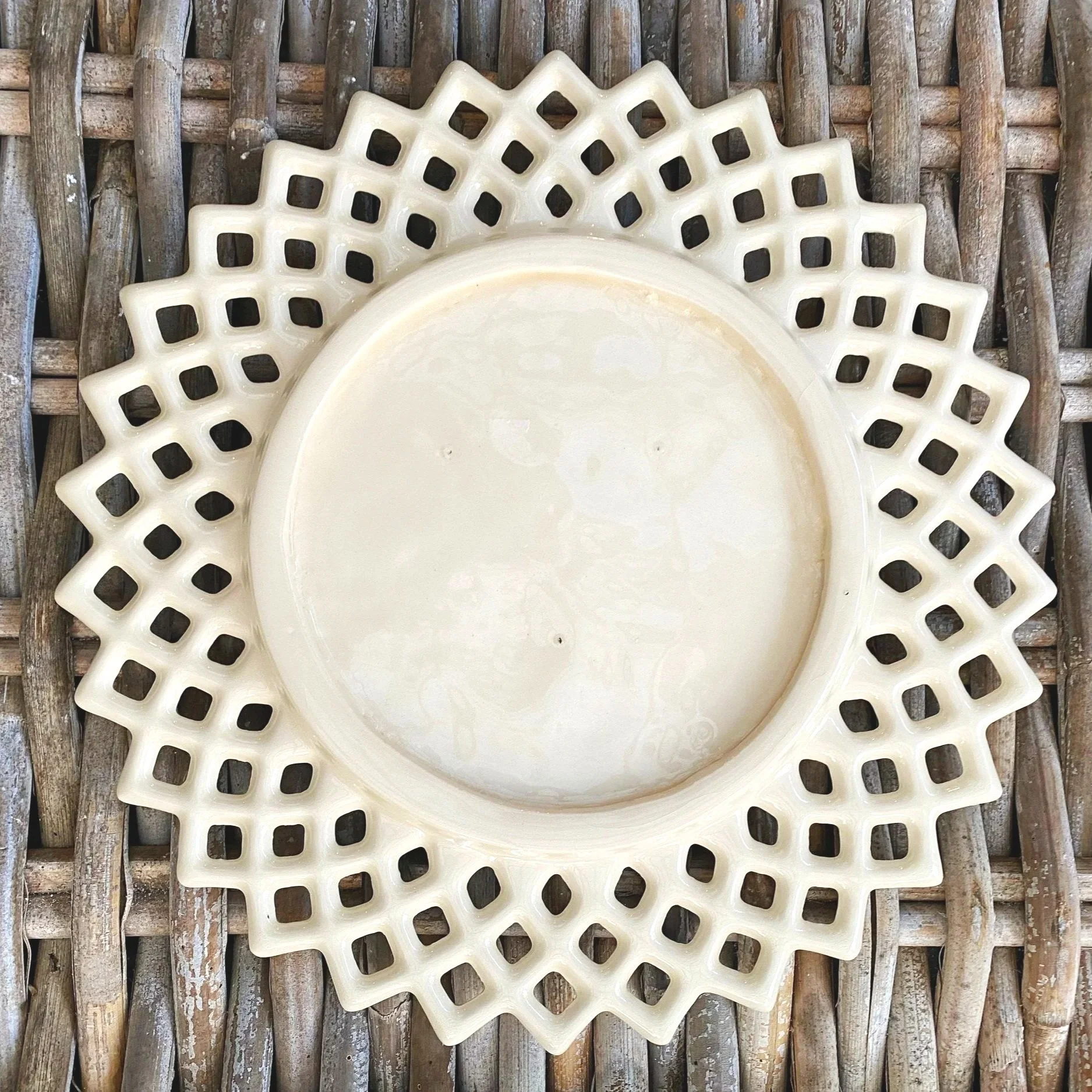 Back view of plate showing unmarked base and vintage patina