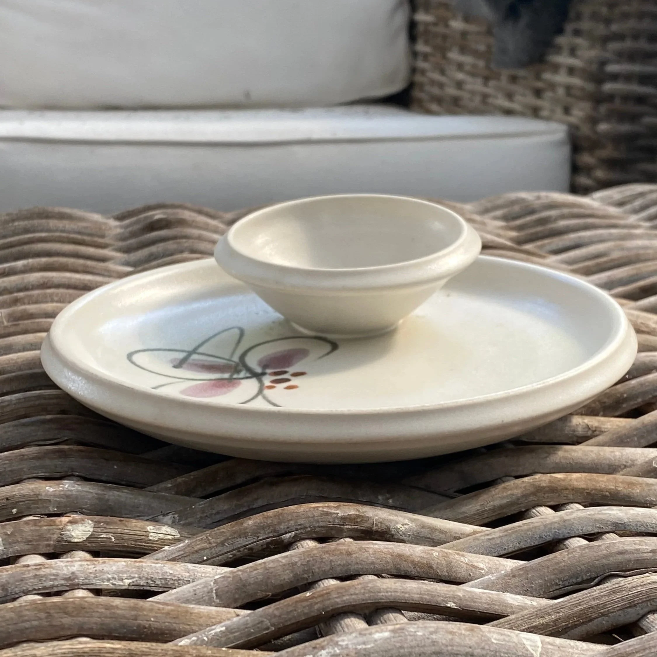 Angled side view showing dish depth and dip bowl placement