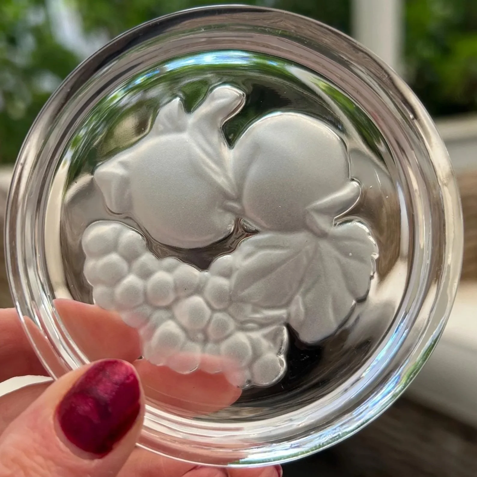 Close-up of one Val St. Lambert wine coaster showing frosted grapes and leaves design