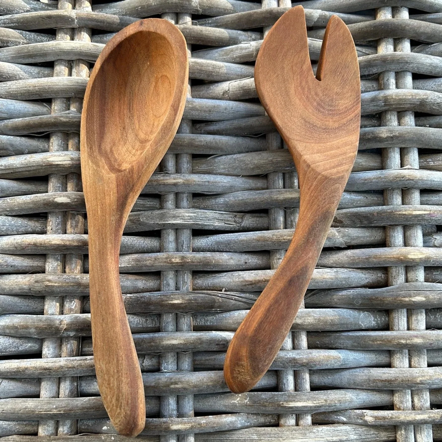 Wooden salad spoon and fork set with natural teak grain