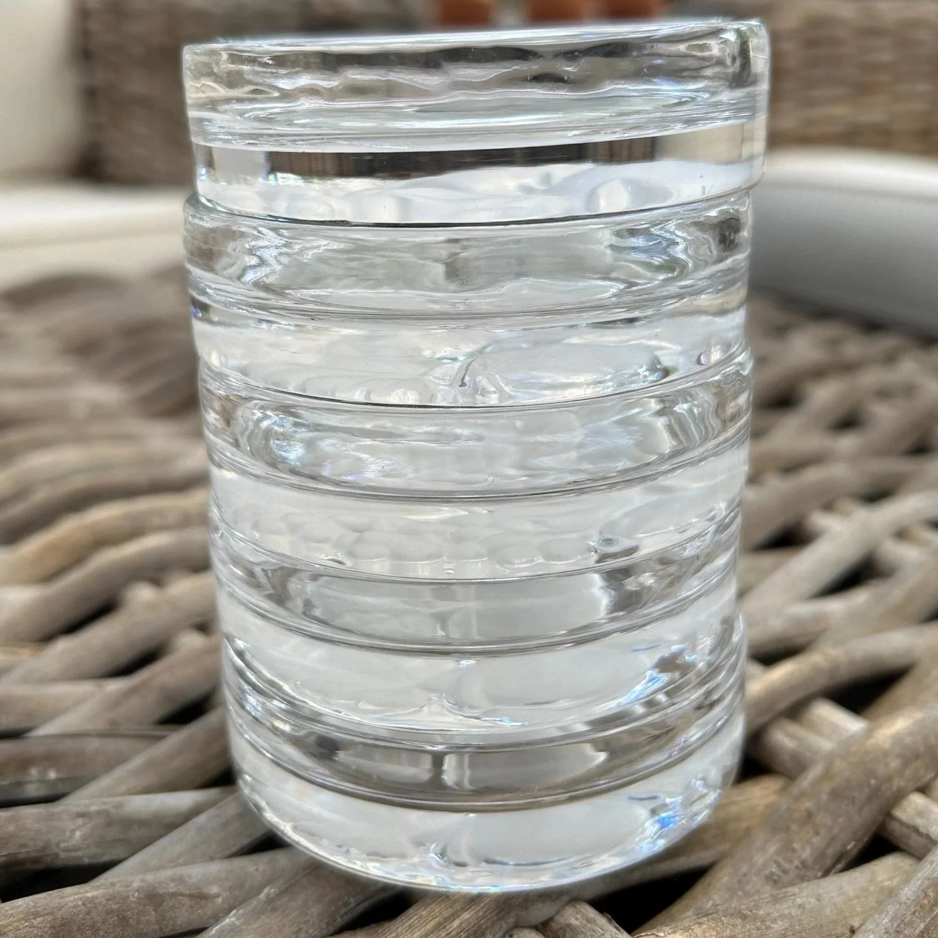 Stack of 5 coasters viewed from the side, showing how neatly they nest