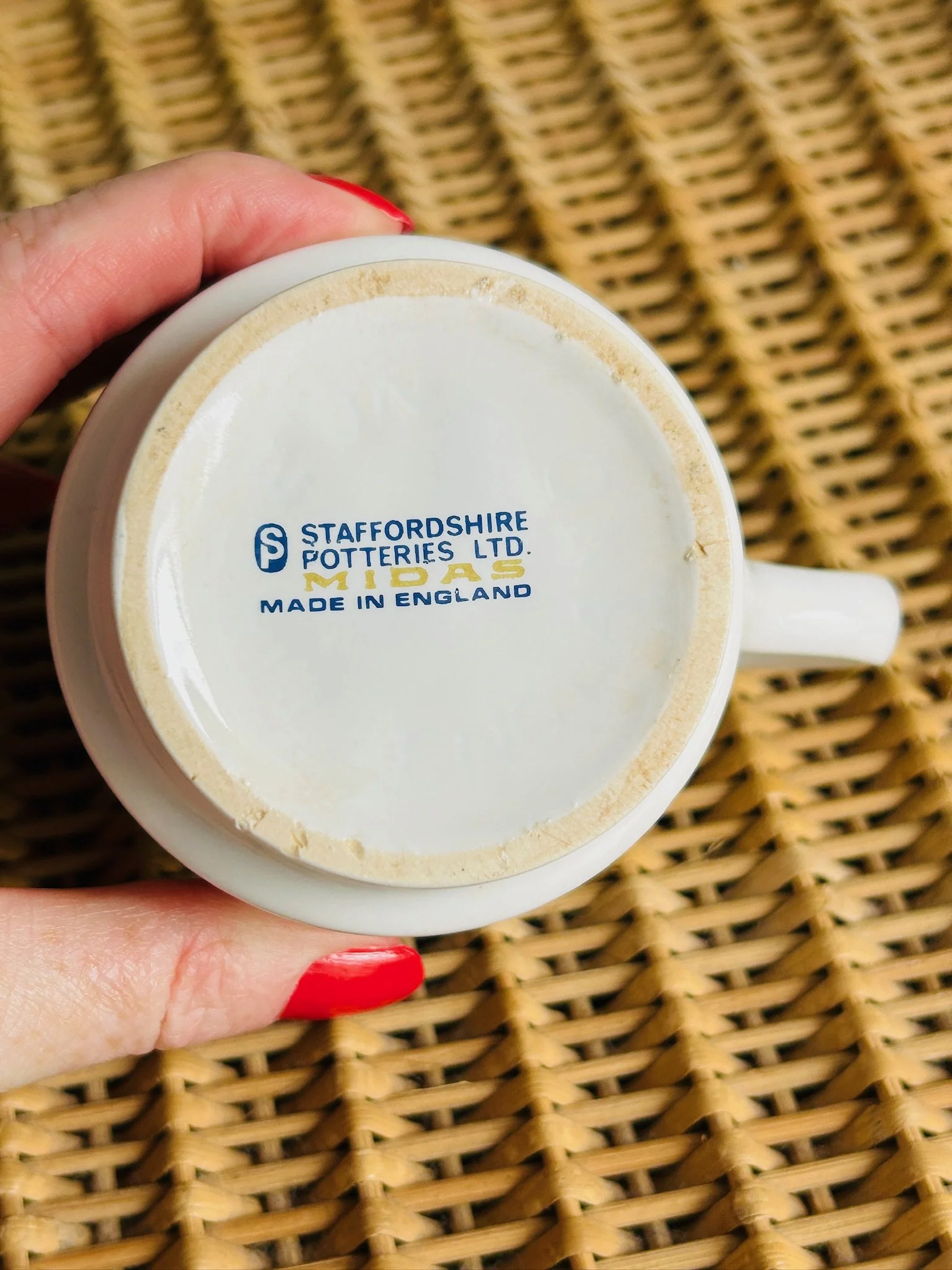 Close-up of base stamp reading Staffordshire Potteries Ltd Midas Made in England.