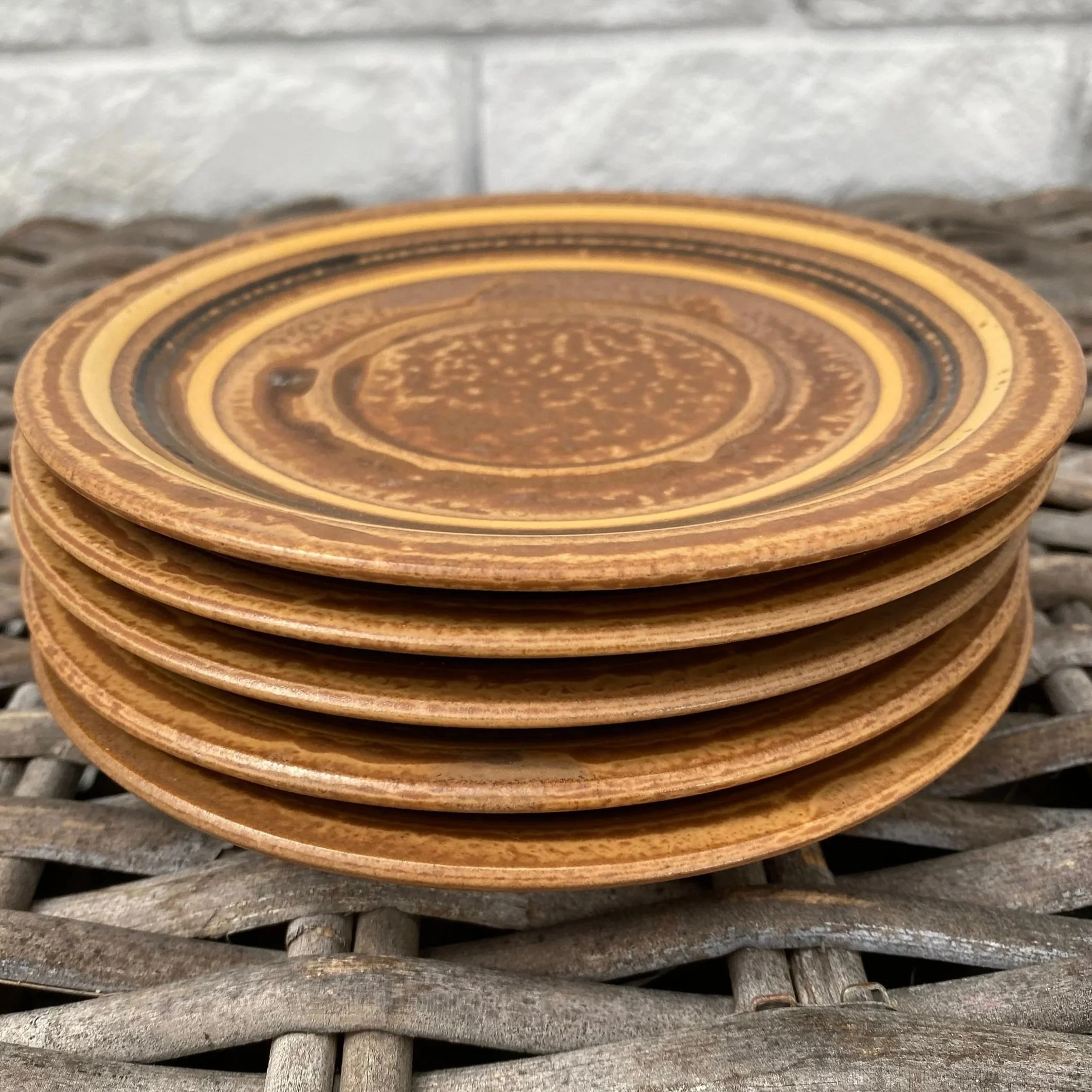 Stack of saucers showing layered glaze and uniform size