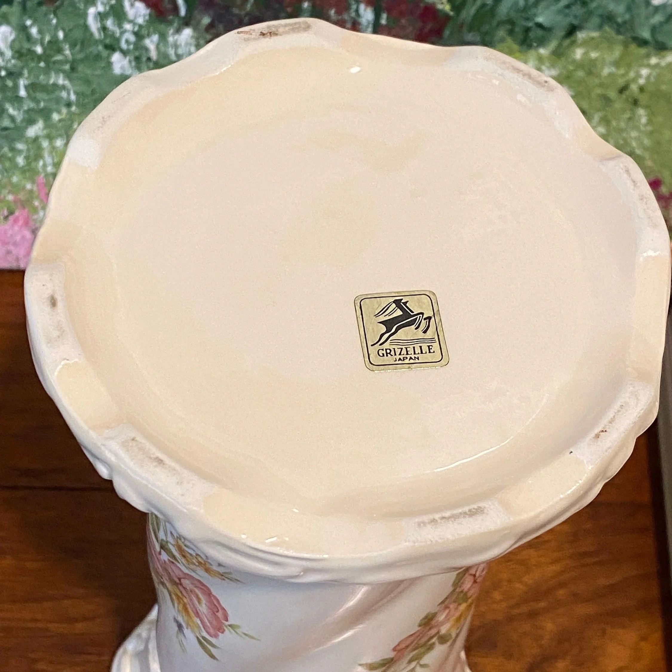 Top view of porcelain vase showing scalloped rim and maker’s mark on base