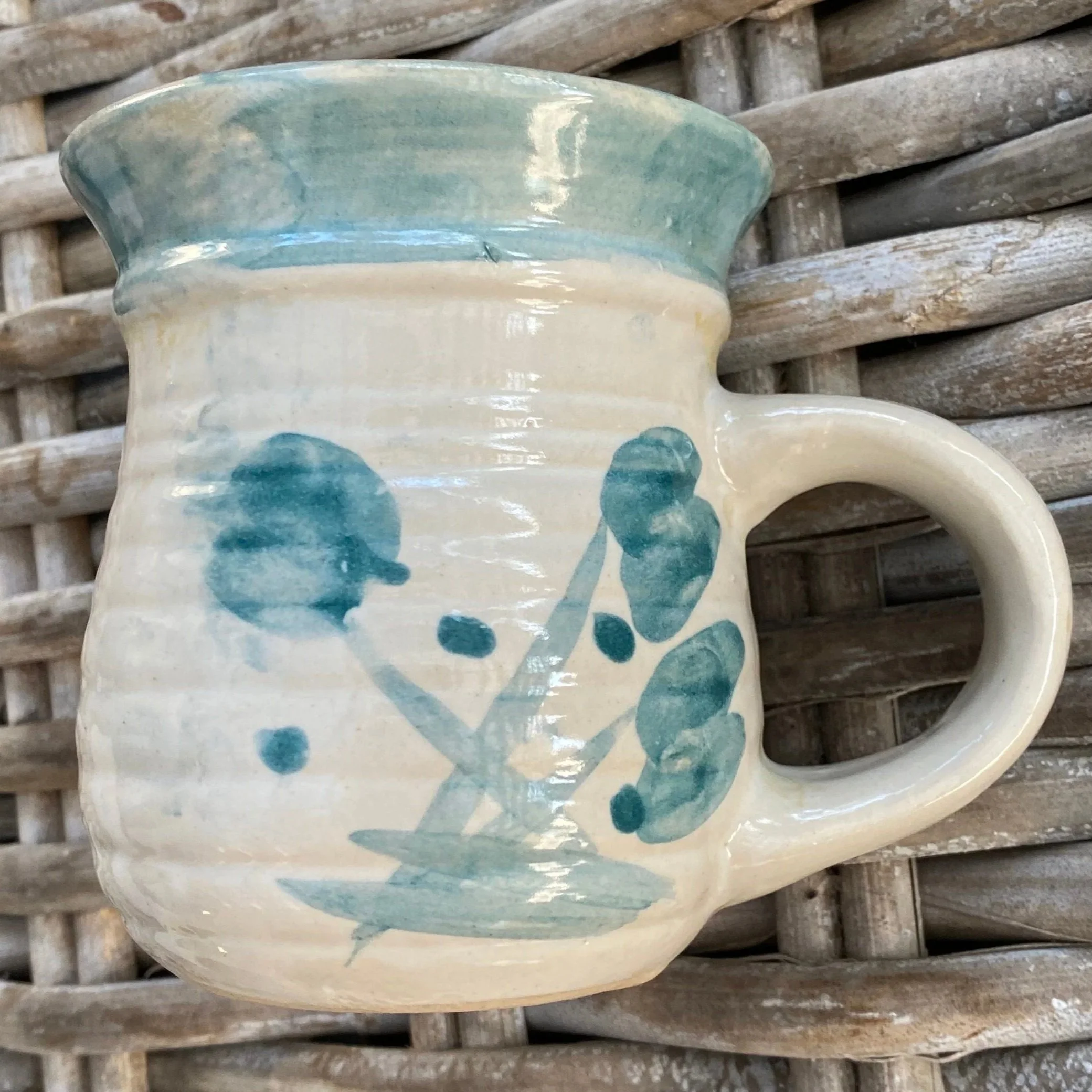 Alternate side of mug showing botanical hand-painted brushwork