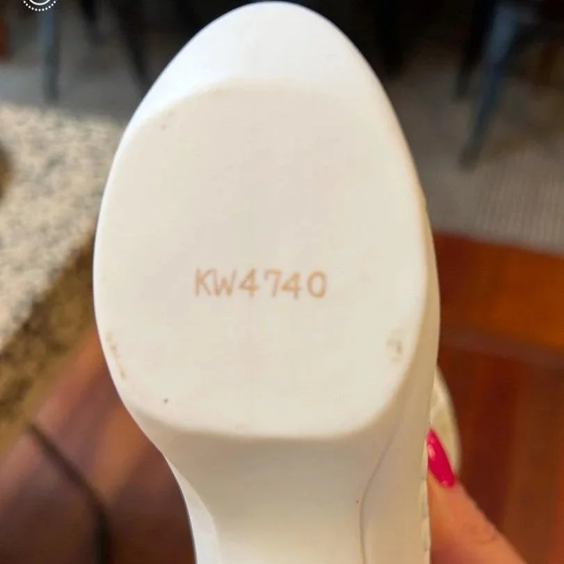 Base of boot vase with “KW4740” stamped mark visible